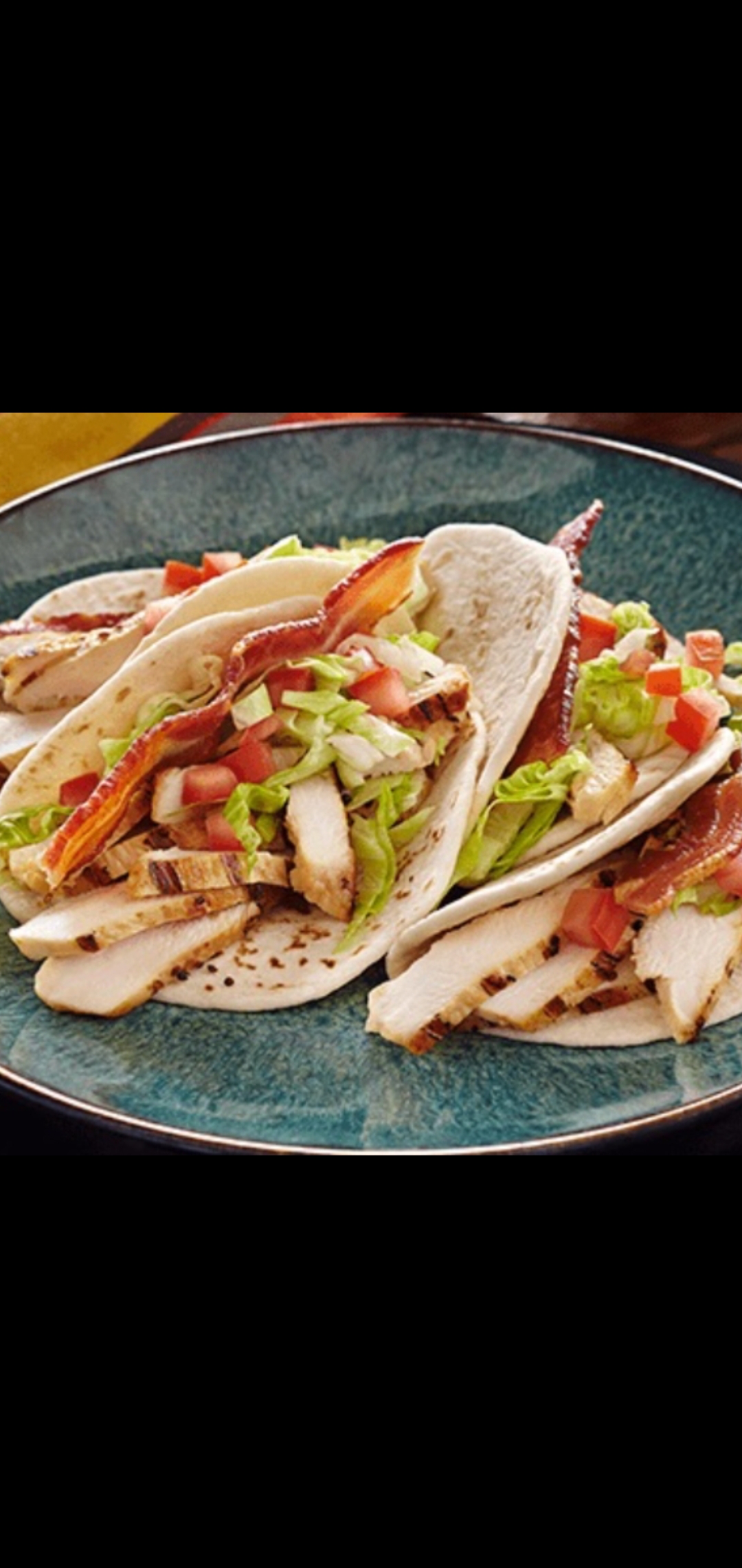 Order Chicken Club Tacos (grilled chicken, bacon, lettuce, tomatoes, pepper  jack cheese & Caesar dressing on soft corn taco) food online from American Gourmet Foods Deli store, New York on bringmethat.com