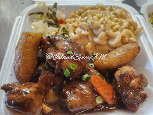 Order Brown Stew Chicken food online from Island Spice Jamaican Restaurant store, Leavenworth on bringmethat.com