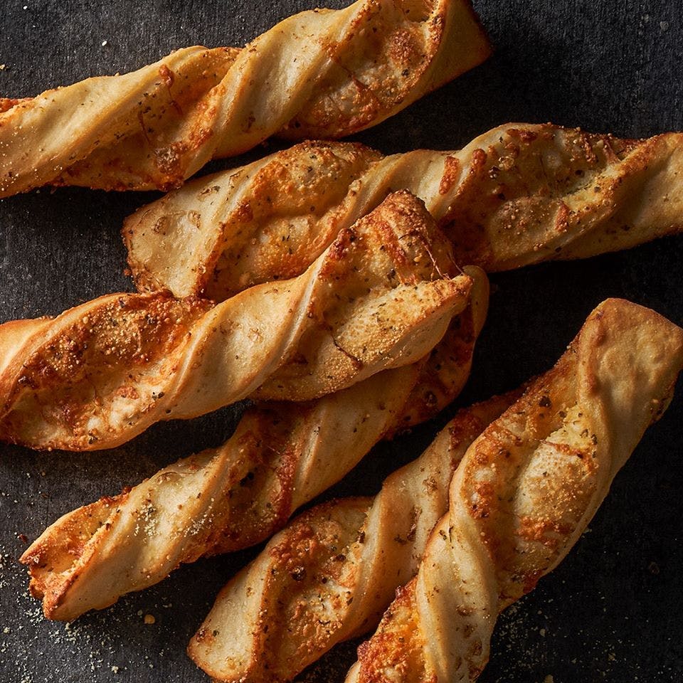 Order Garlic Parmesan Twists - 3 Pieces food online from Round Table Pizza store, La Habra on bringmethat.com