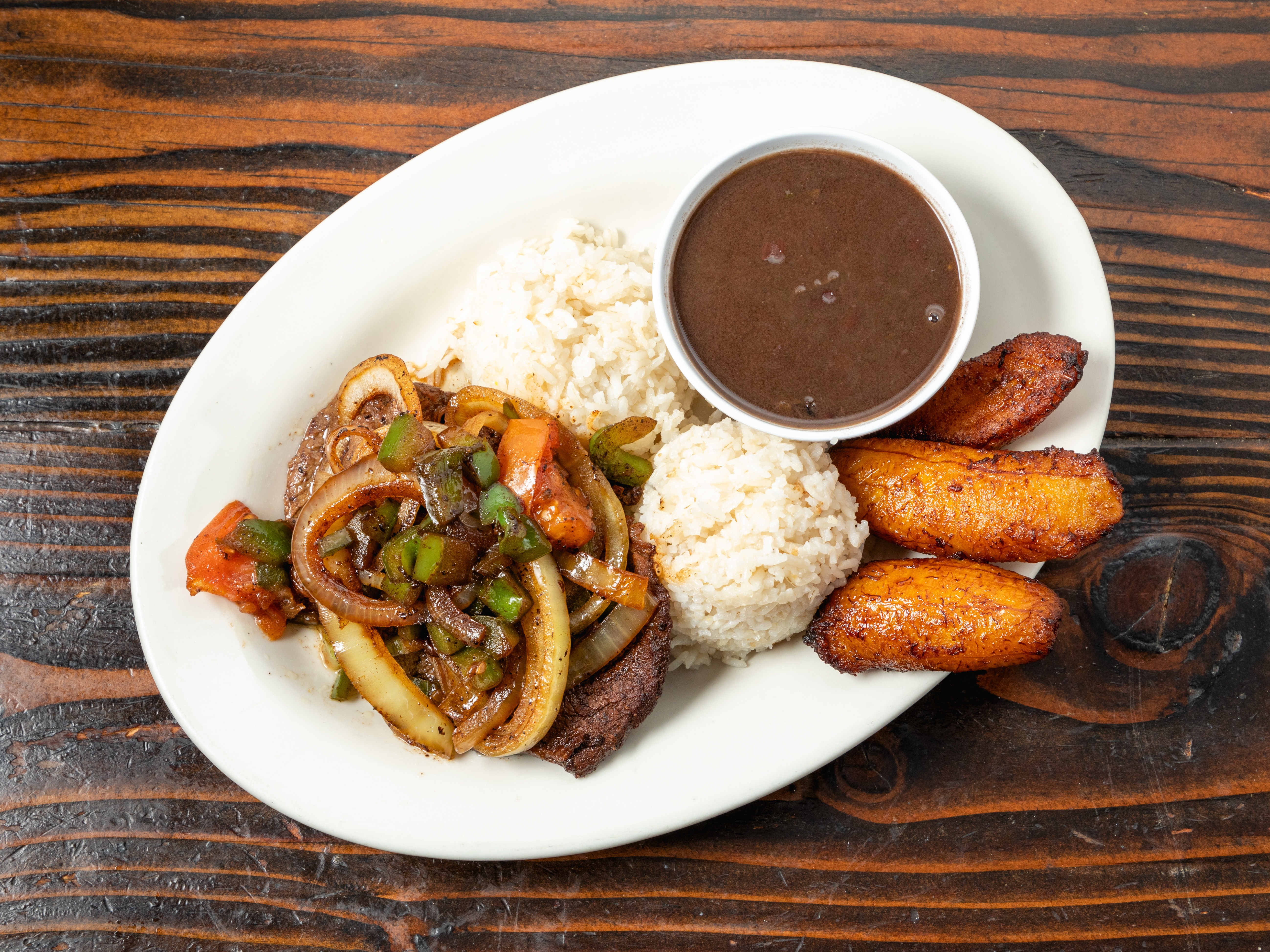 Order Bistec Criollo food online from Caveman Kitchen store, Los Angeles on bringmethat.com