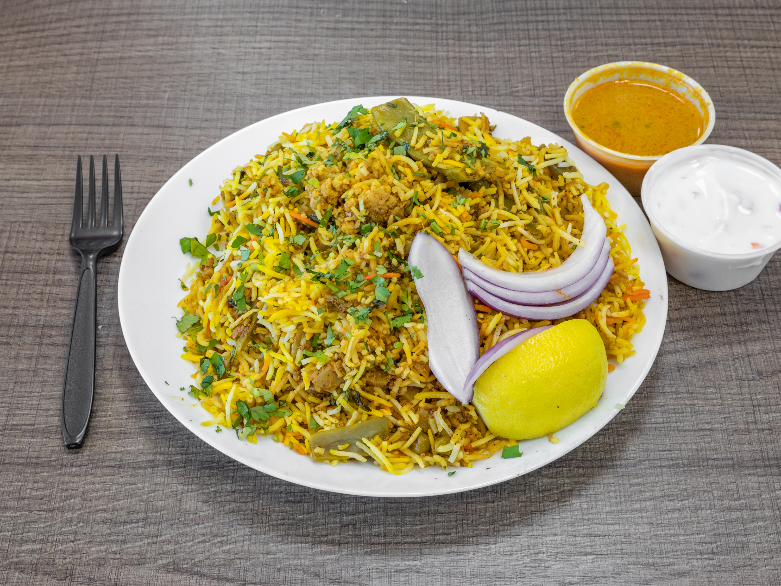 Order Vegetable Dum Biryani food online from Saffron Indian Grocery N Kitchen store, Scottsdale on bringmethat.com