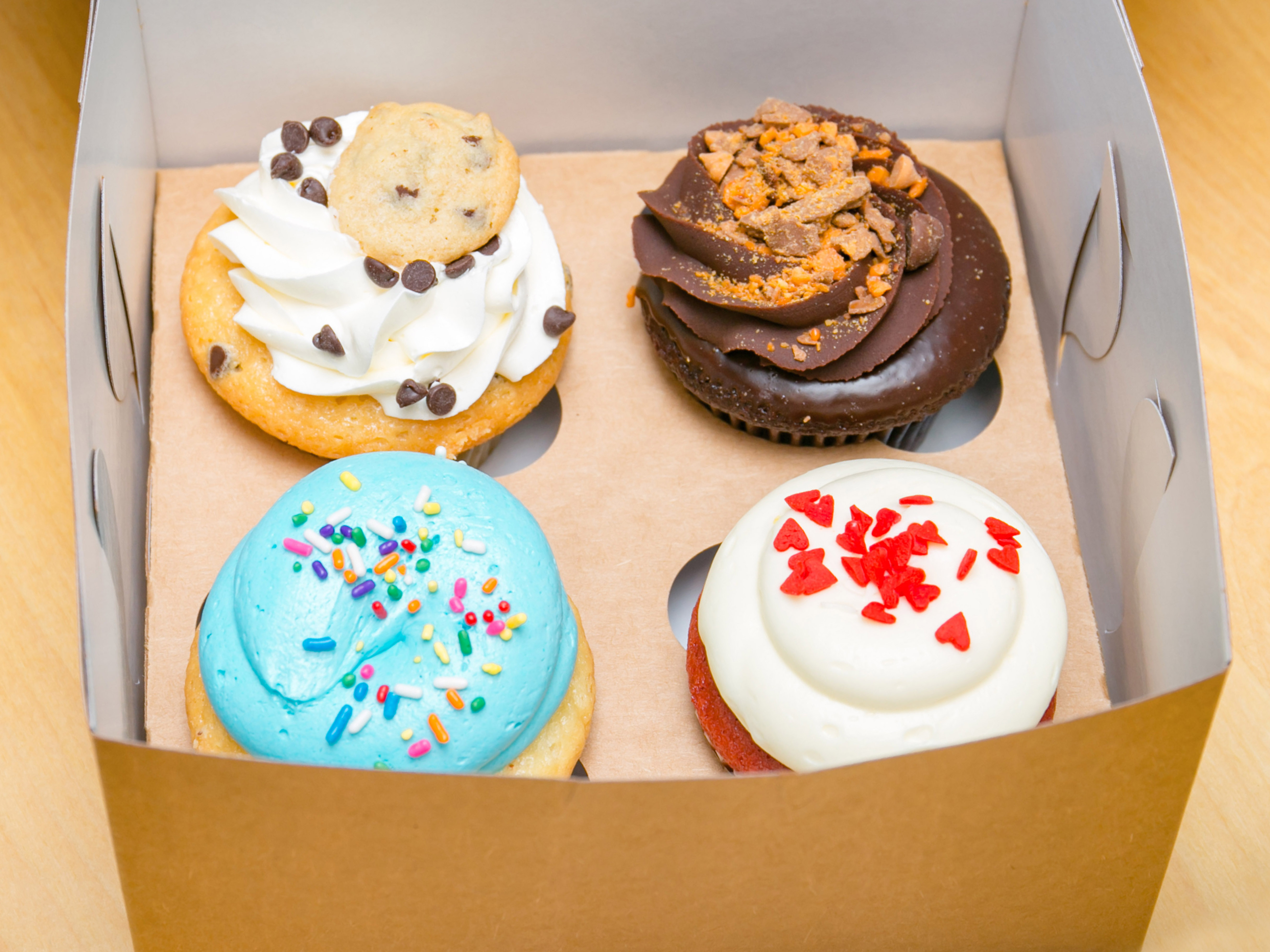 Order 12 Assorted Centerfilled food online from Molly's Cupcakes store, Chicago on bringmethat.com