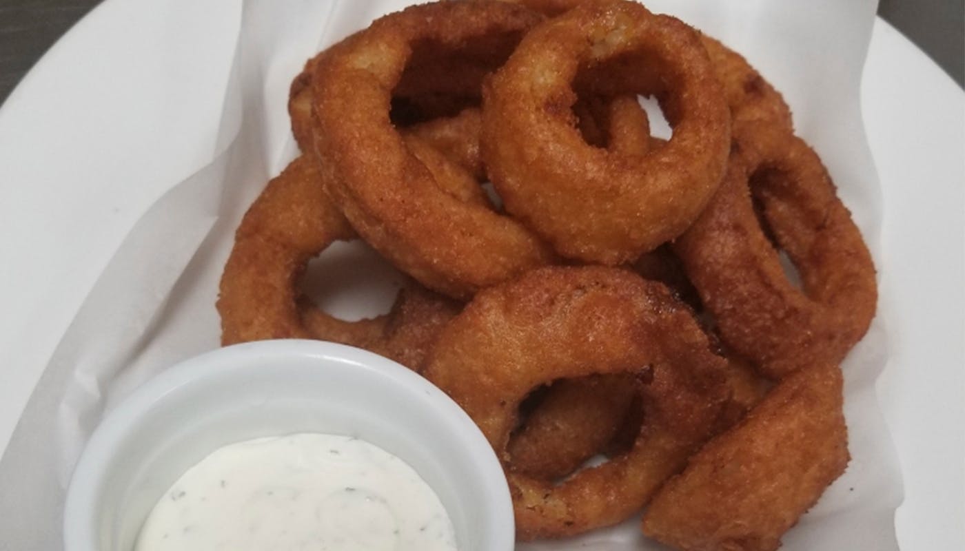 Order Homestyle Beer Battered Onion Rings - Side food online from New York New York Pizza store, La Mesa on bringmethat.com