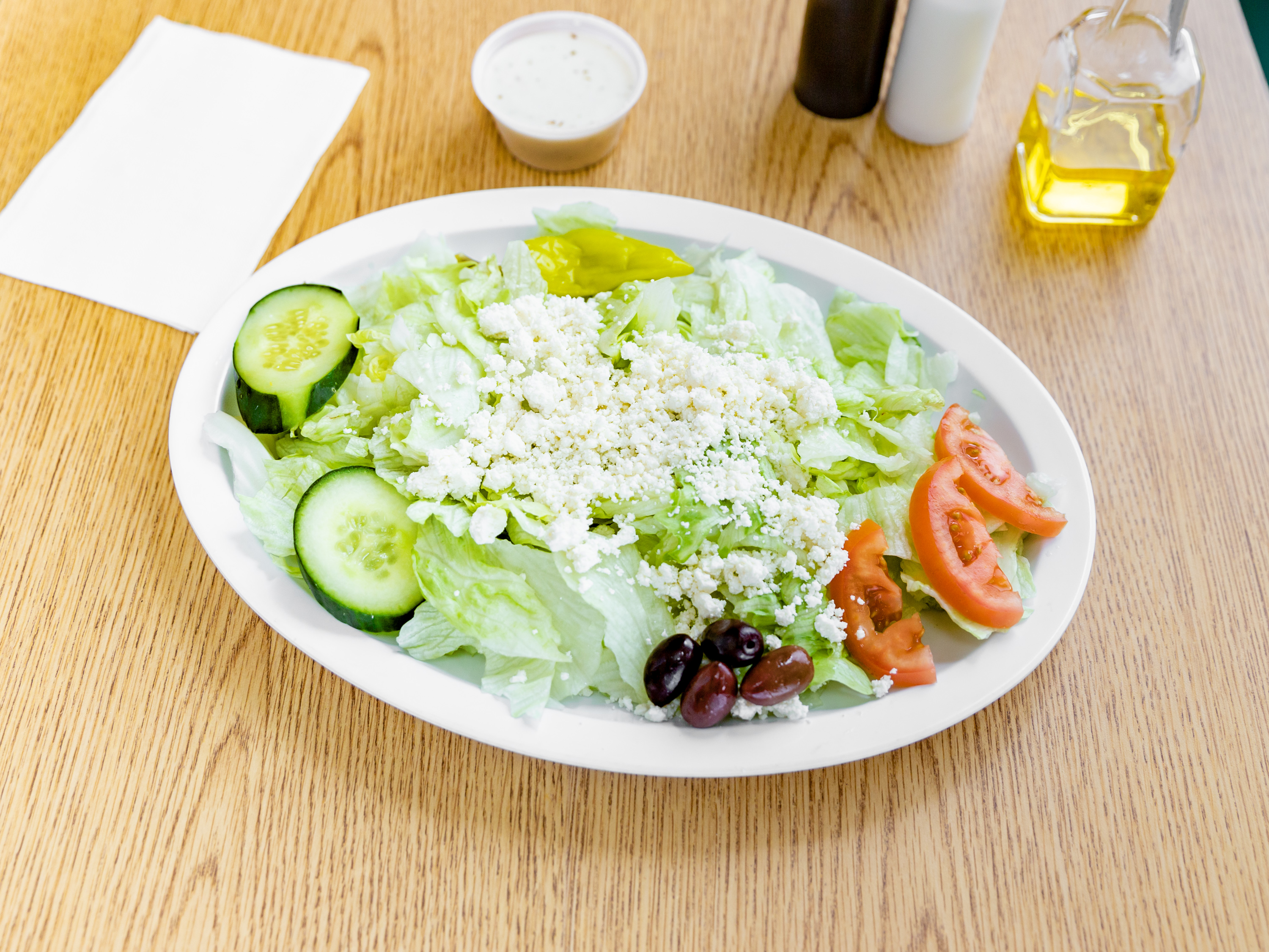 Order Greek Salad food online from Crazy Pizza store, Cumberland on bringmethat.com