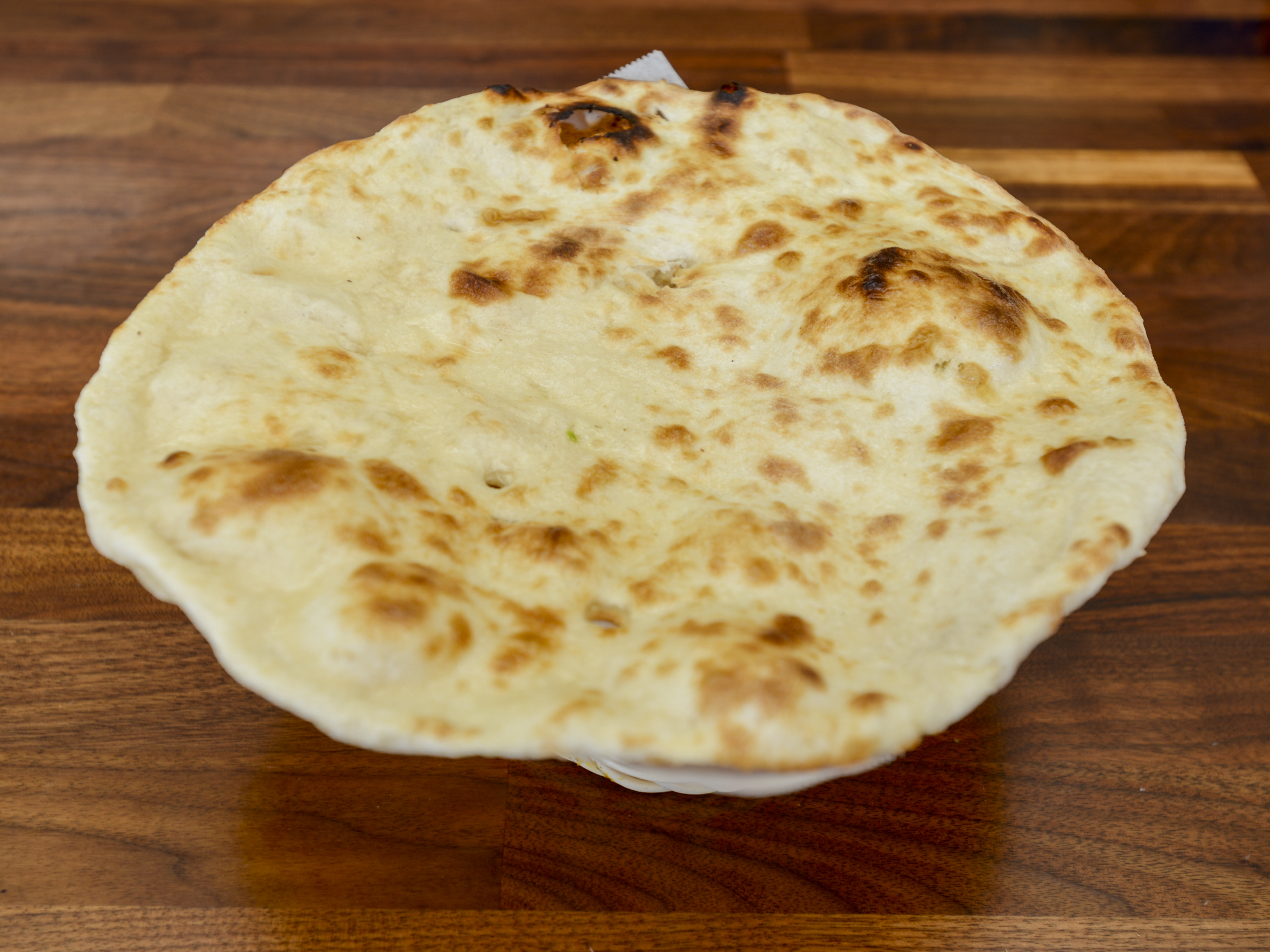 Order Butter Naan food online from Naan & Curry store, San Jose on bringmethat.com