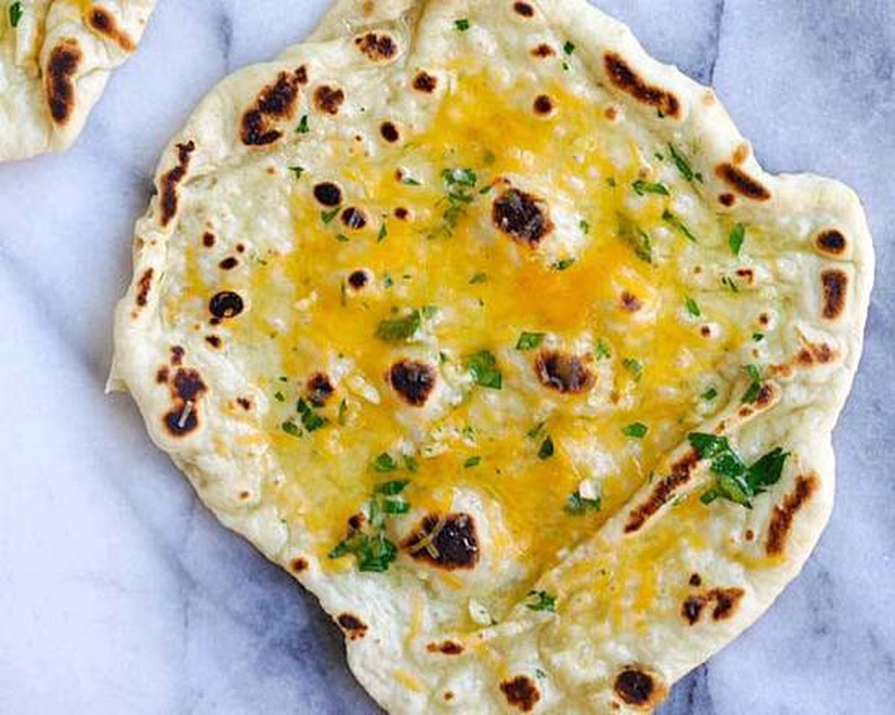 Order Cheese Naan food online from Deccan House store, San Francisco on bringmethat.com