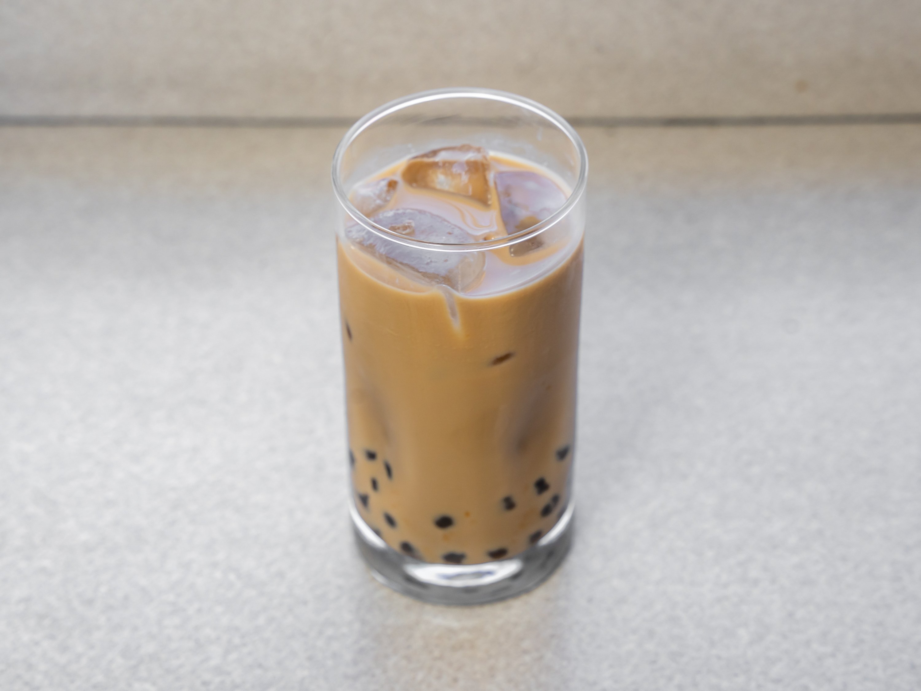 Order Milk Tea food online from Glaze Donuts And Bagel Sandwiches store, San Francisco on bringmethat.com