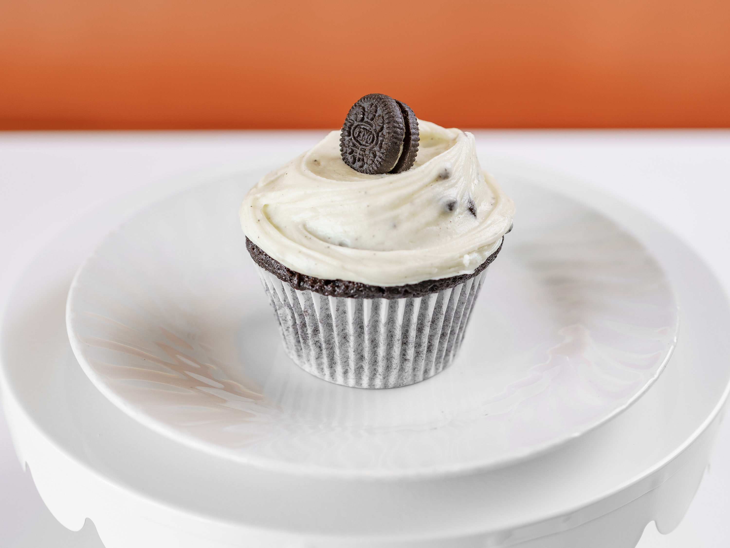 Order Chocolate / Cookies and Cream Buttercream Cupcake food online from Frosted Cupcakery store, Long Beach on bringmethat.com