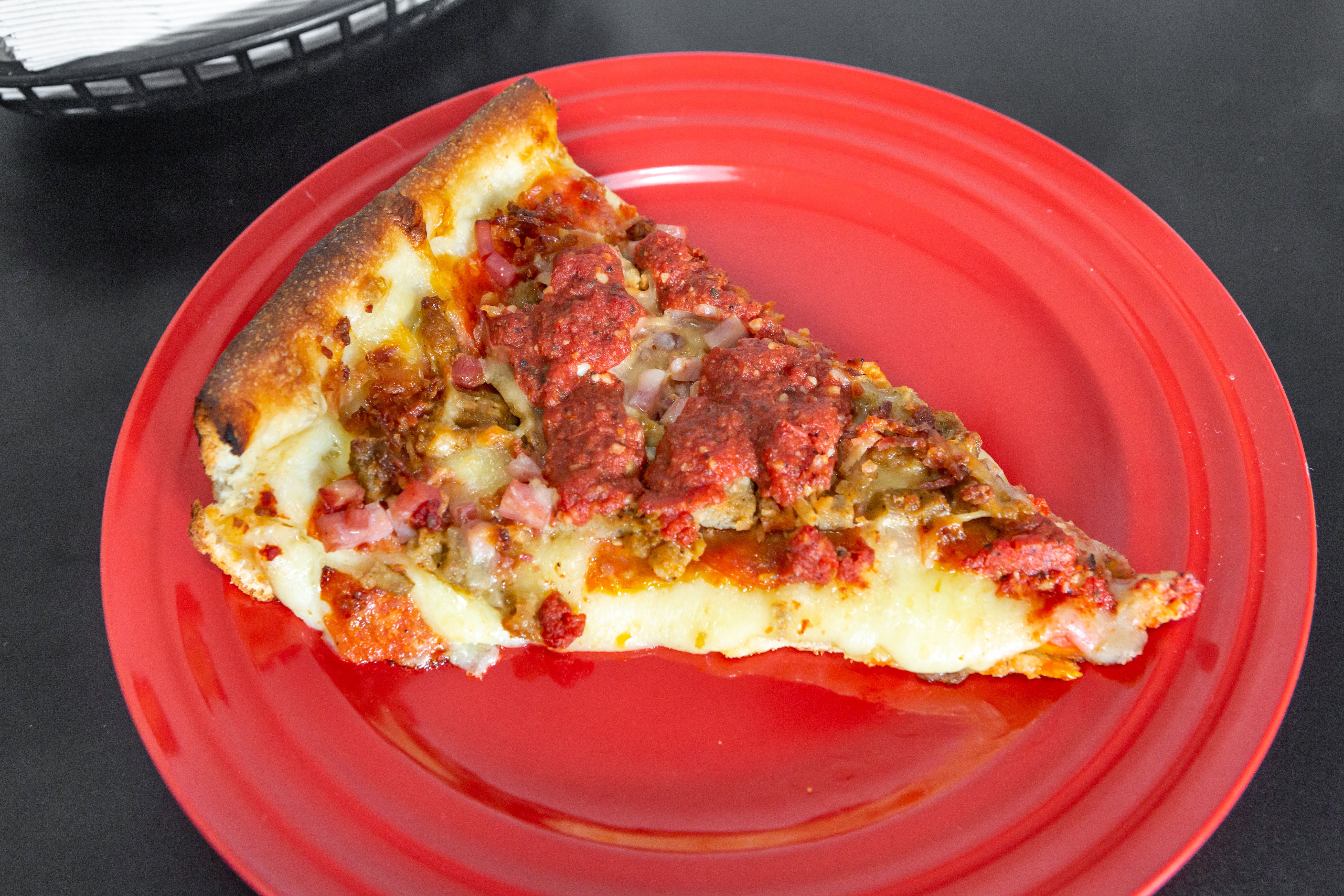 Order Chicago Meat Lovers Deep Dish Pizza - Small 10'' food online from Tangy Tomato store, Syracuse on bringmethat.com