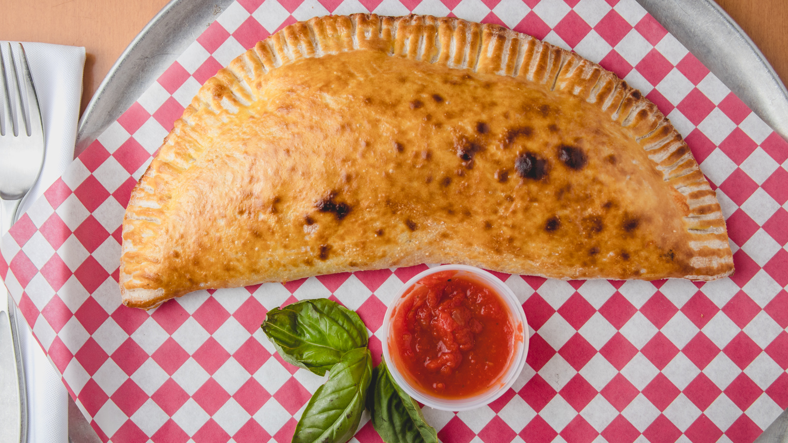Order Calzones food online from La Famiglia Wood Fired Pizzeria store, Humble on bringmethat.com