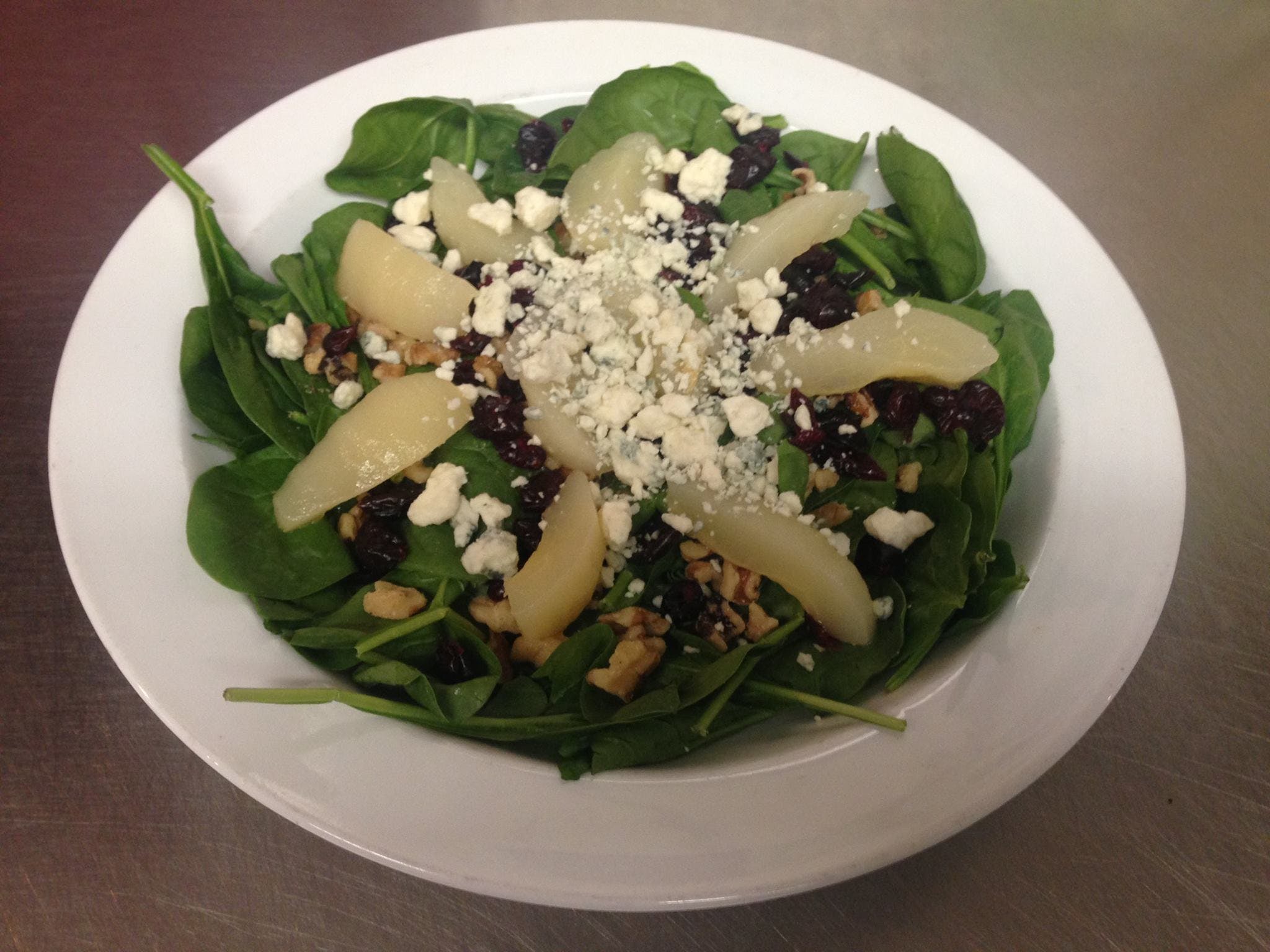 Order Pear Spinach Salad - Small food online from Mario Cafe & Pizzeria store, East Greenville on bringmethat.com