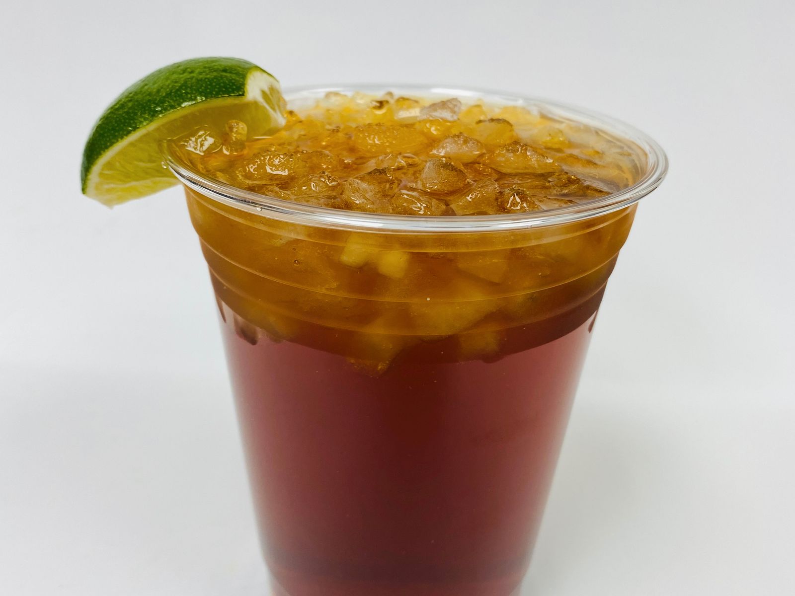 Order ICED TROPICAL TEA (UNSWEETENED) food online from Pinto Urban Thai Diner store, Richardson on bringmethat.com