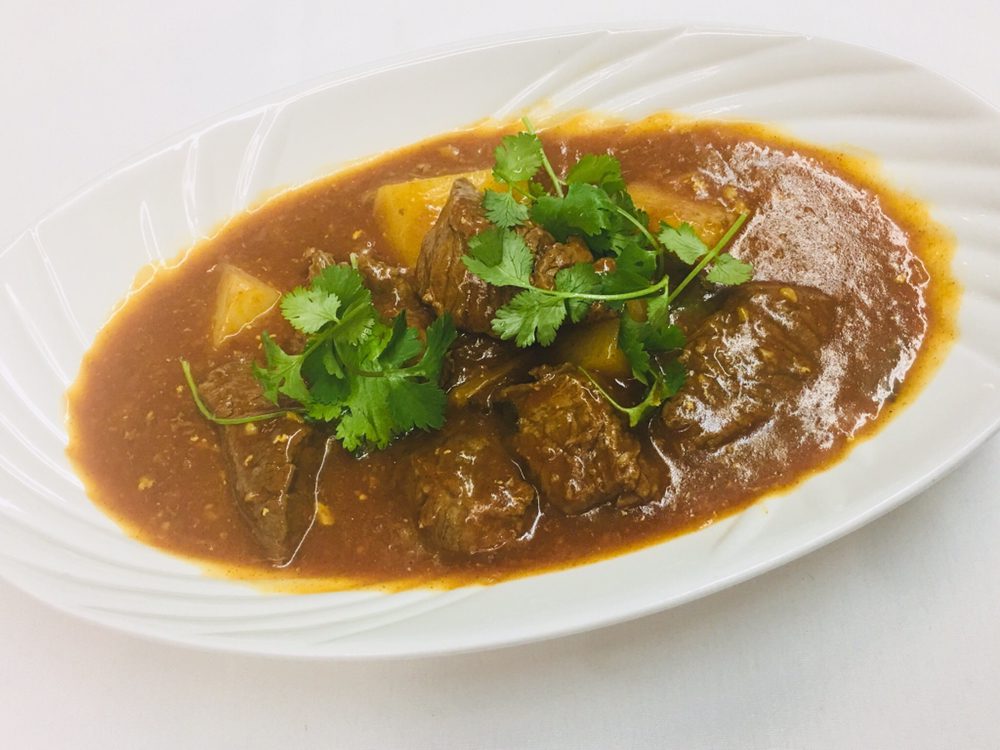 Order Curry Pork food online from Green Elephant Gourmet store, Palo Alto on bringmethat.com
