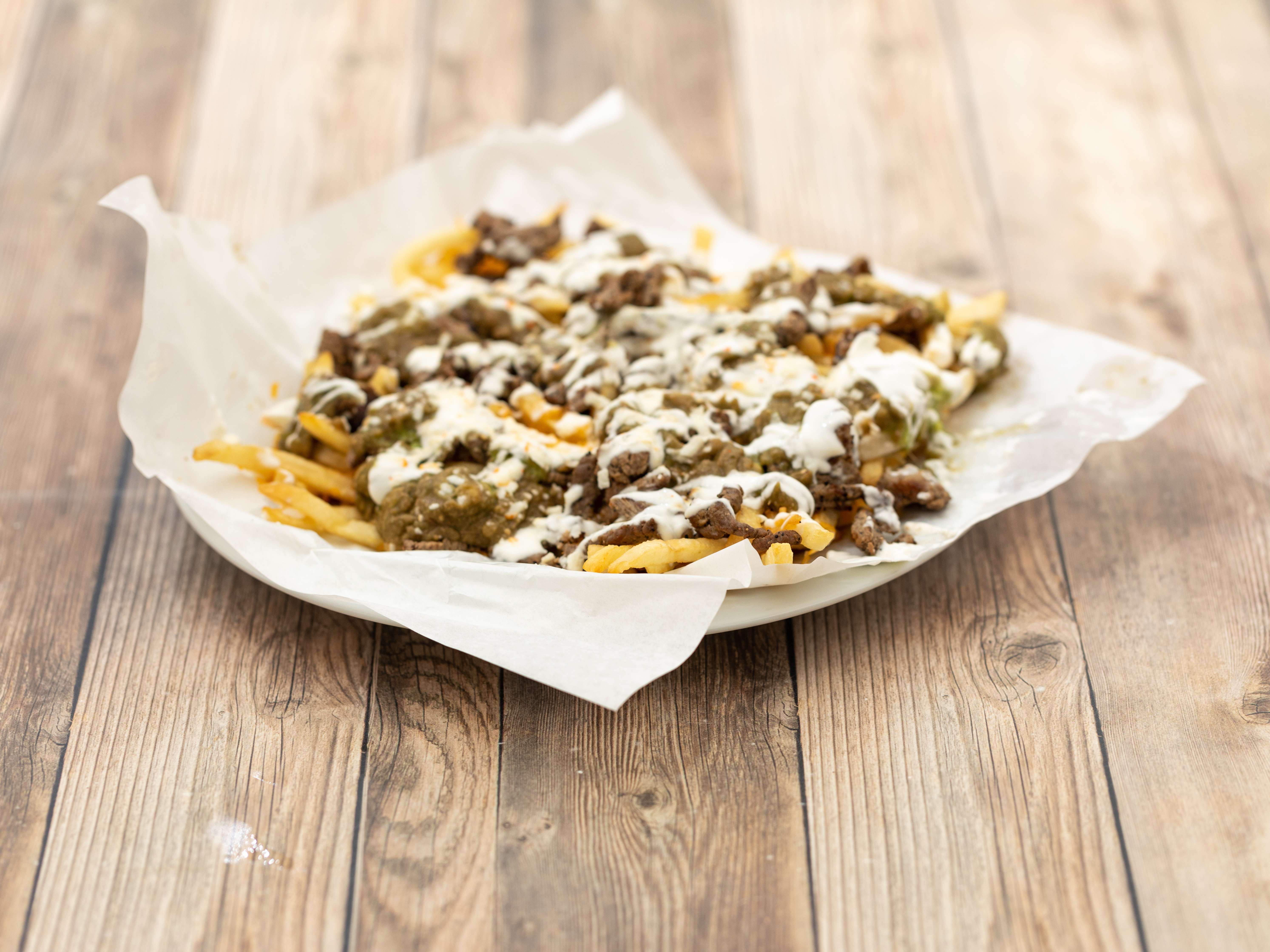 Order Carne Asado Fries food online from Penelopes Mexican Food store, San Diego on bringmethat.com