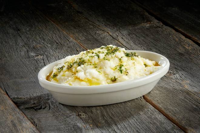 Order Mashed Potatoes Topped with Herb Butter food online from Sizzler store, Inglewood on bringmethat.com