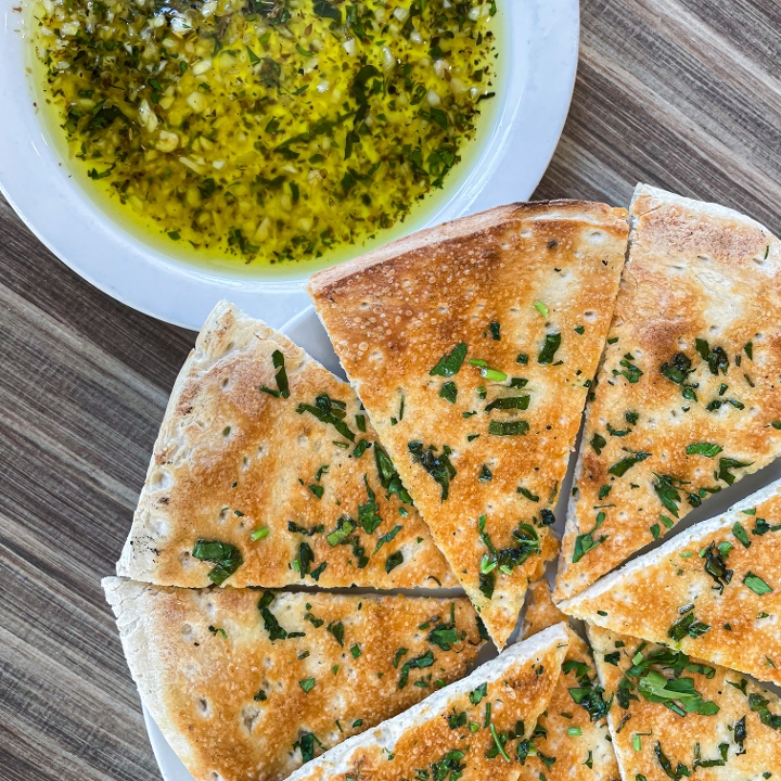 Order Fresh Bread w/ Garlic Olive Oil food online from Ember & Greens store, Houston on bringmethat.com