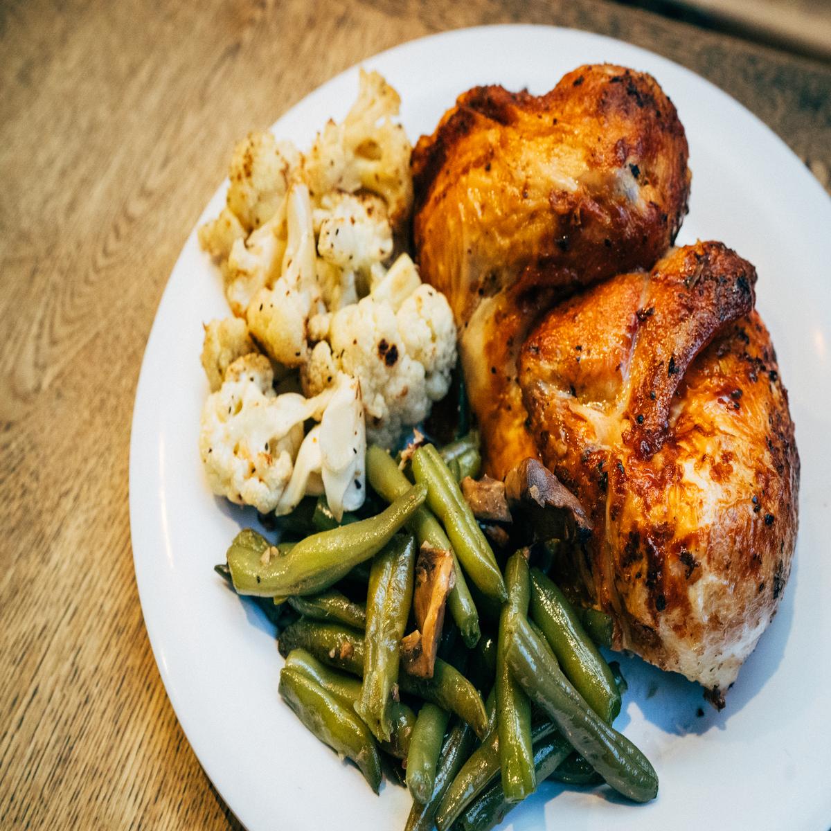 Order 1/2 chicken + 2 sides + 2 sauces food online from Poulette rotisserie chicken store, New York on bringmethat.com