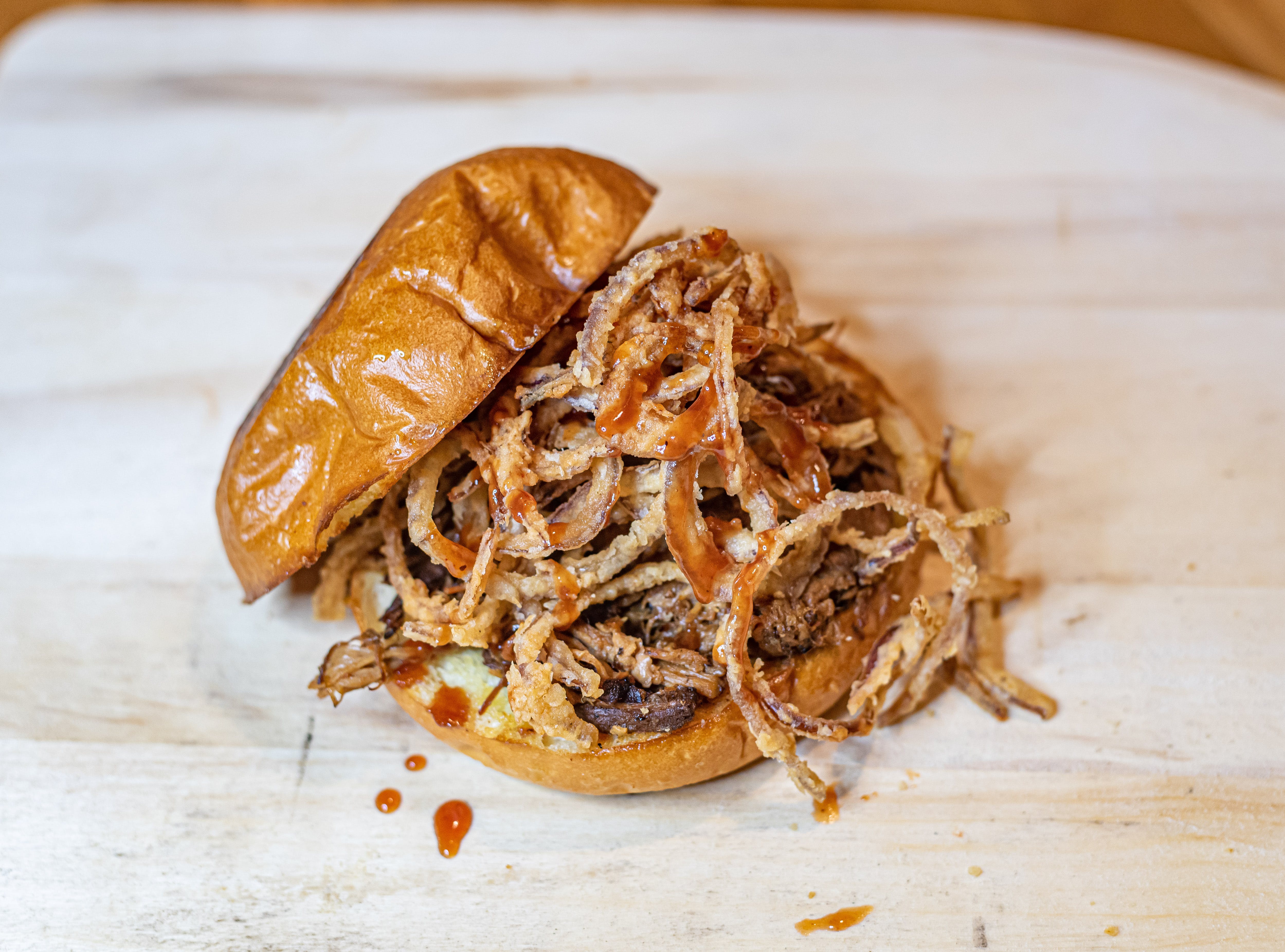 Order BBQ Pulled Pork Sandwich - Sandwich food online from Craftsman Wood Fired Pizza store, Placentia on bringmethat.com
