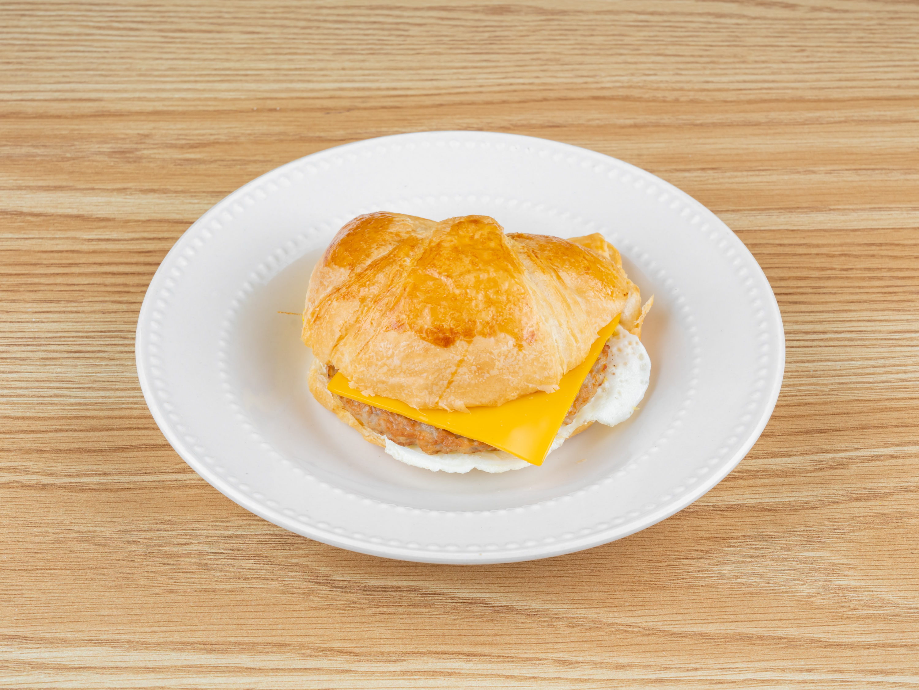 Order Sausage, Egg & Cheese Croissant food online from Goodies Donuts store, Rosharon on bringmethat.com