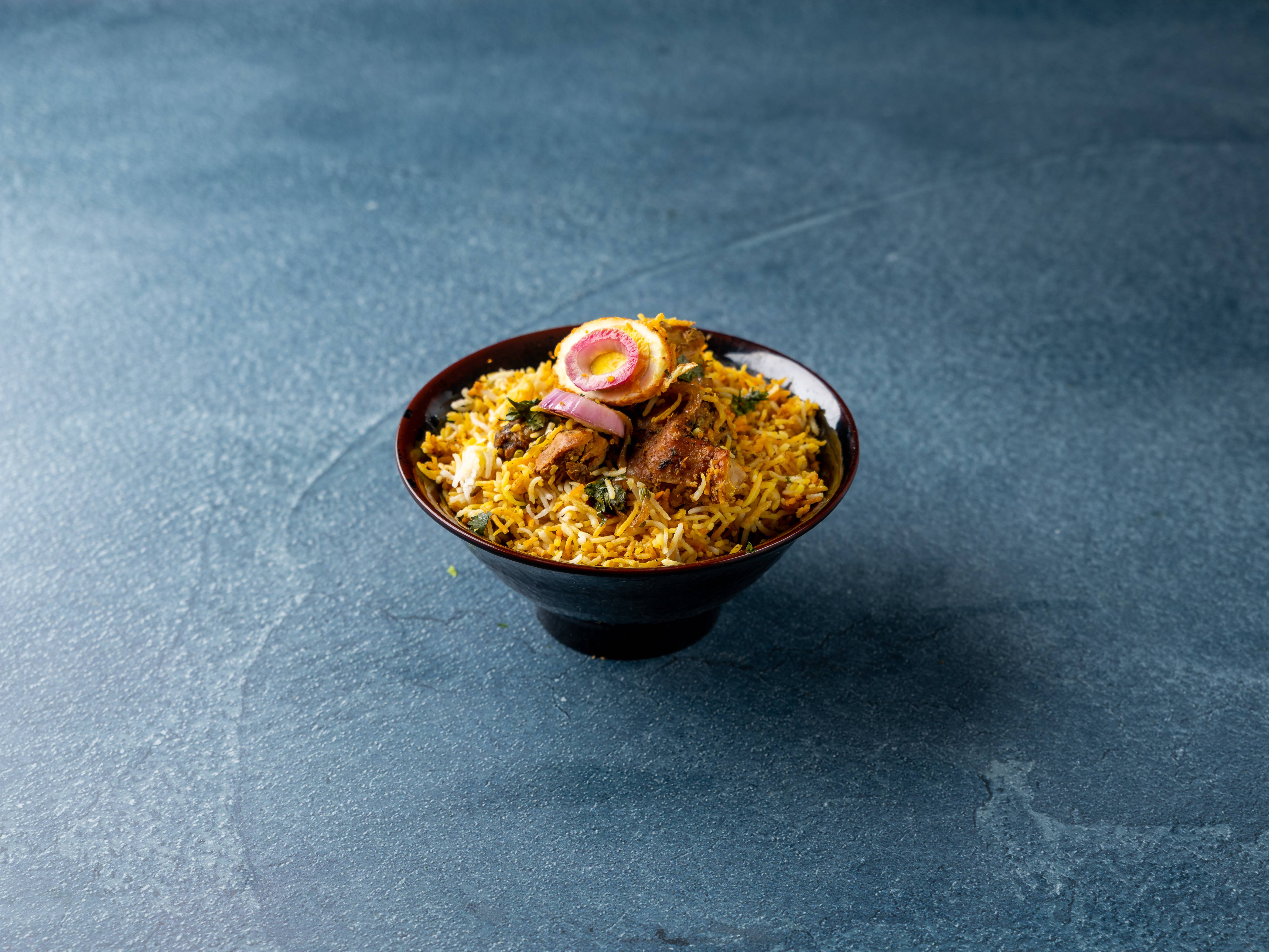 Order Hyderabad Chicken Dum Biryani food online from Siri Indian Restaurant store, Chicago on bringmethat.com
