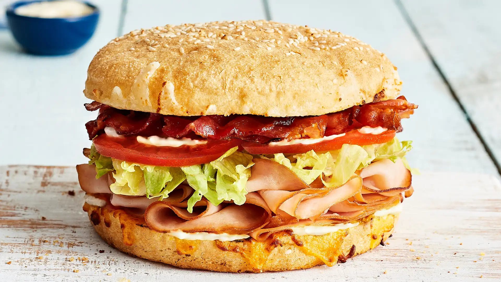Order Turkey Bacon Club Sandwich - Small food online from Schlotzsky store, Lockhart on bringmethat.com
