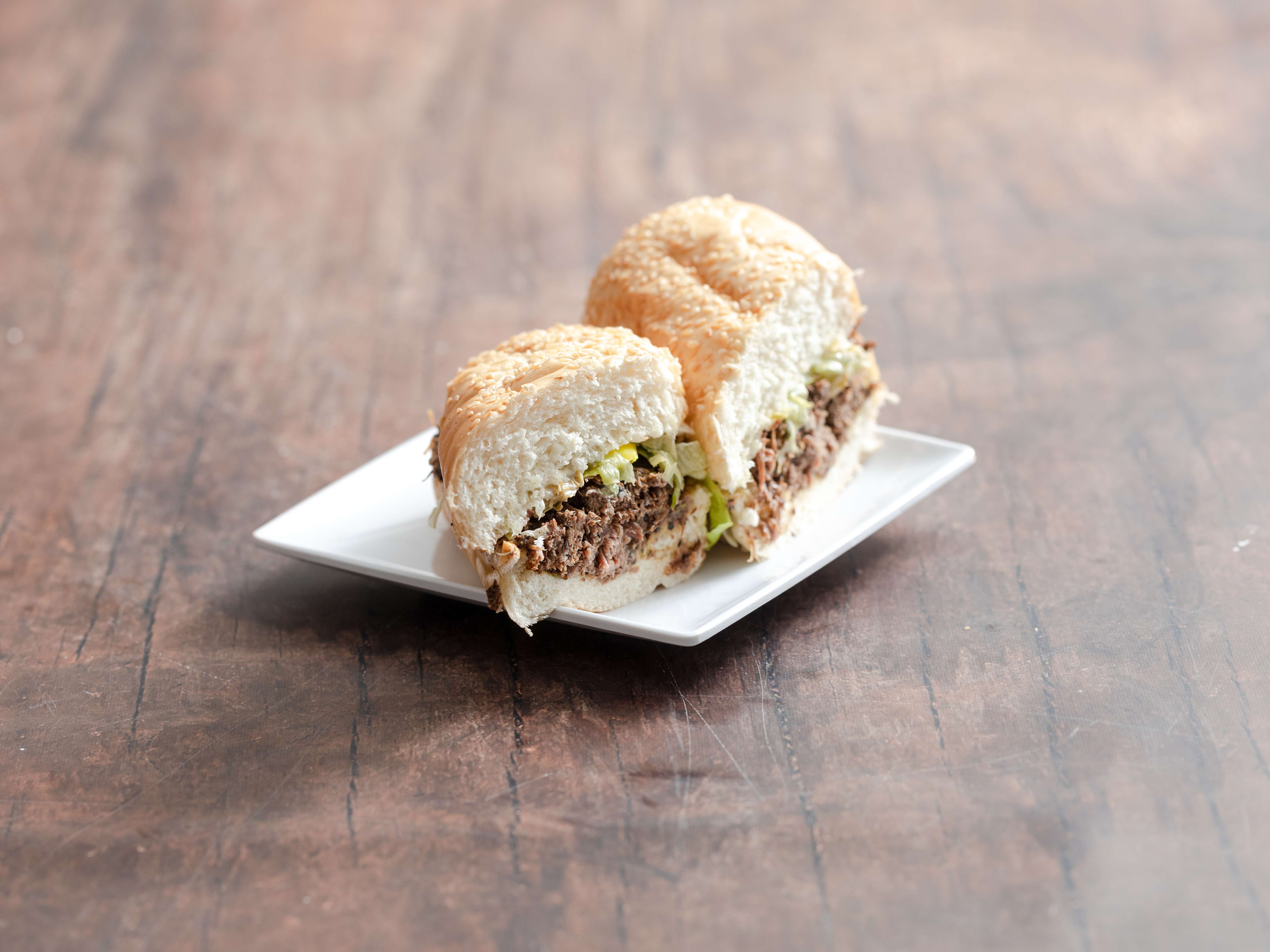 Order Deep-Pit Beef Sandwich food online from Caesar Ii Delicatessen store, Bakersfield on bringmethat.com