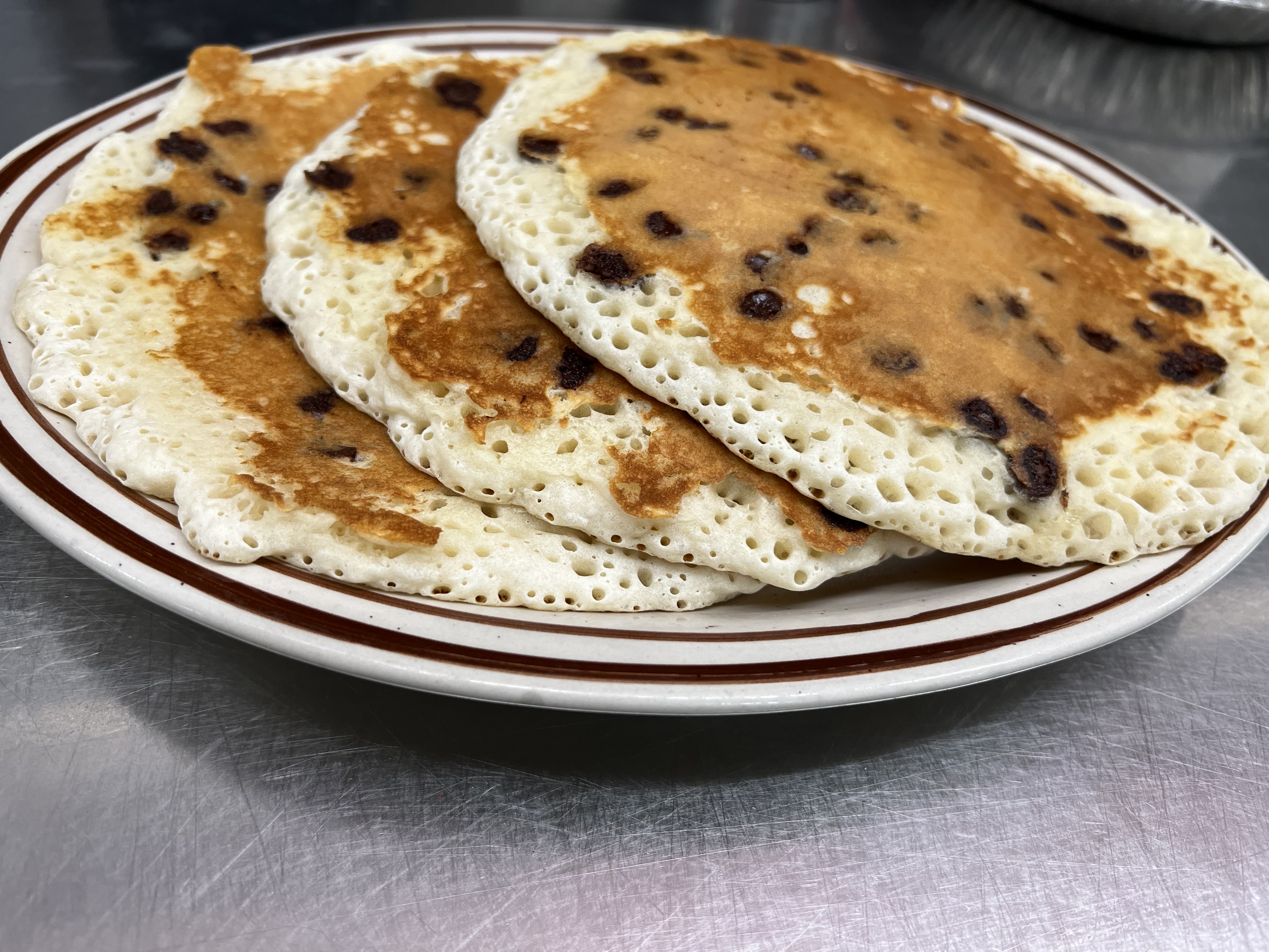 Order Chocolate Chip Pancakes food online from Eastridge Family Restaurant store, Rochester on bringmethat.com