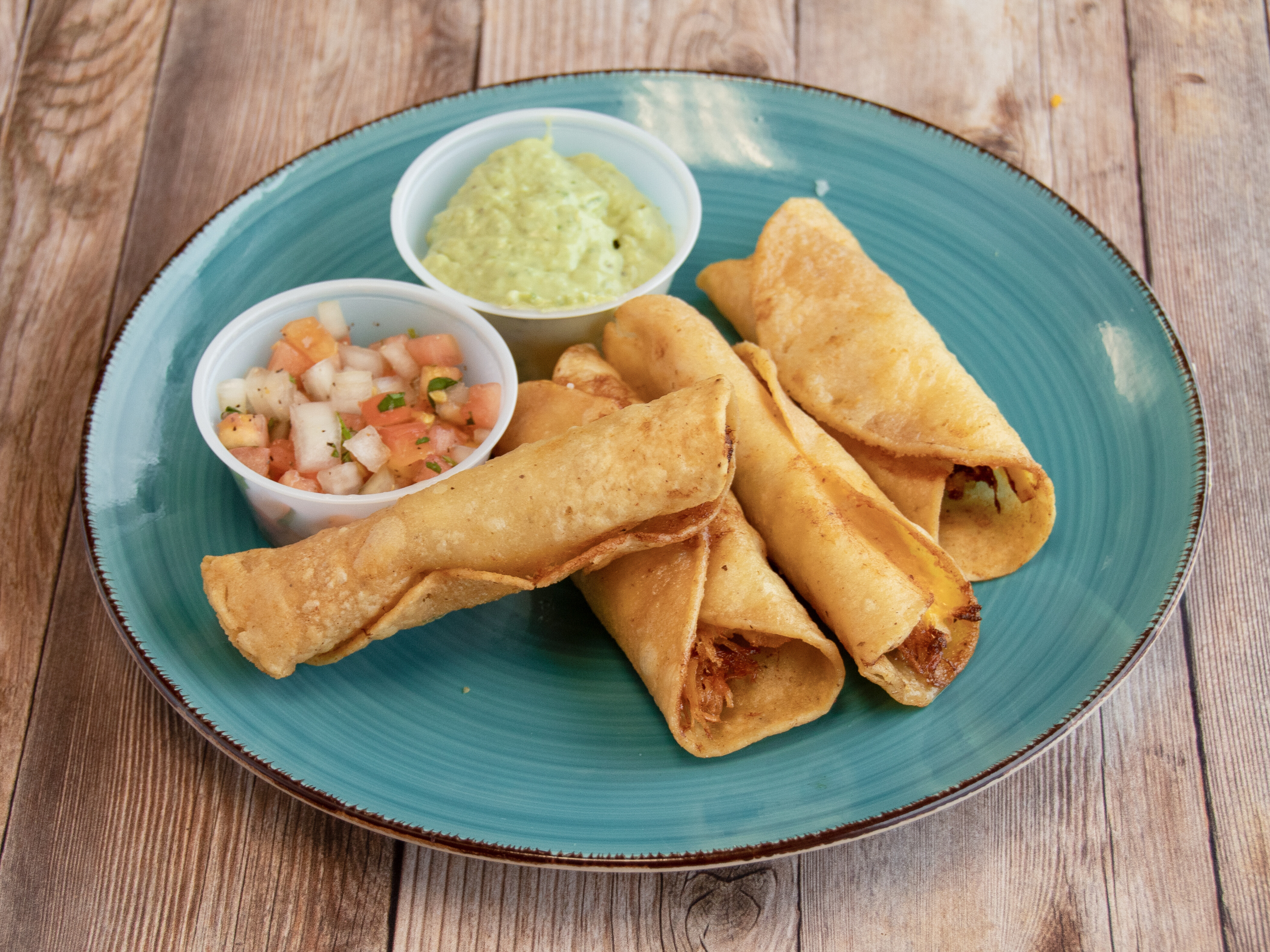 Order Taquitos food online from Trini Mexican Carry Out store, New Baltimore on bringmethat.com