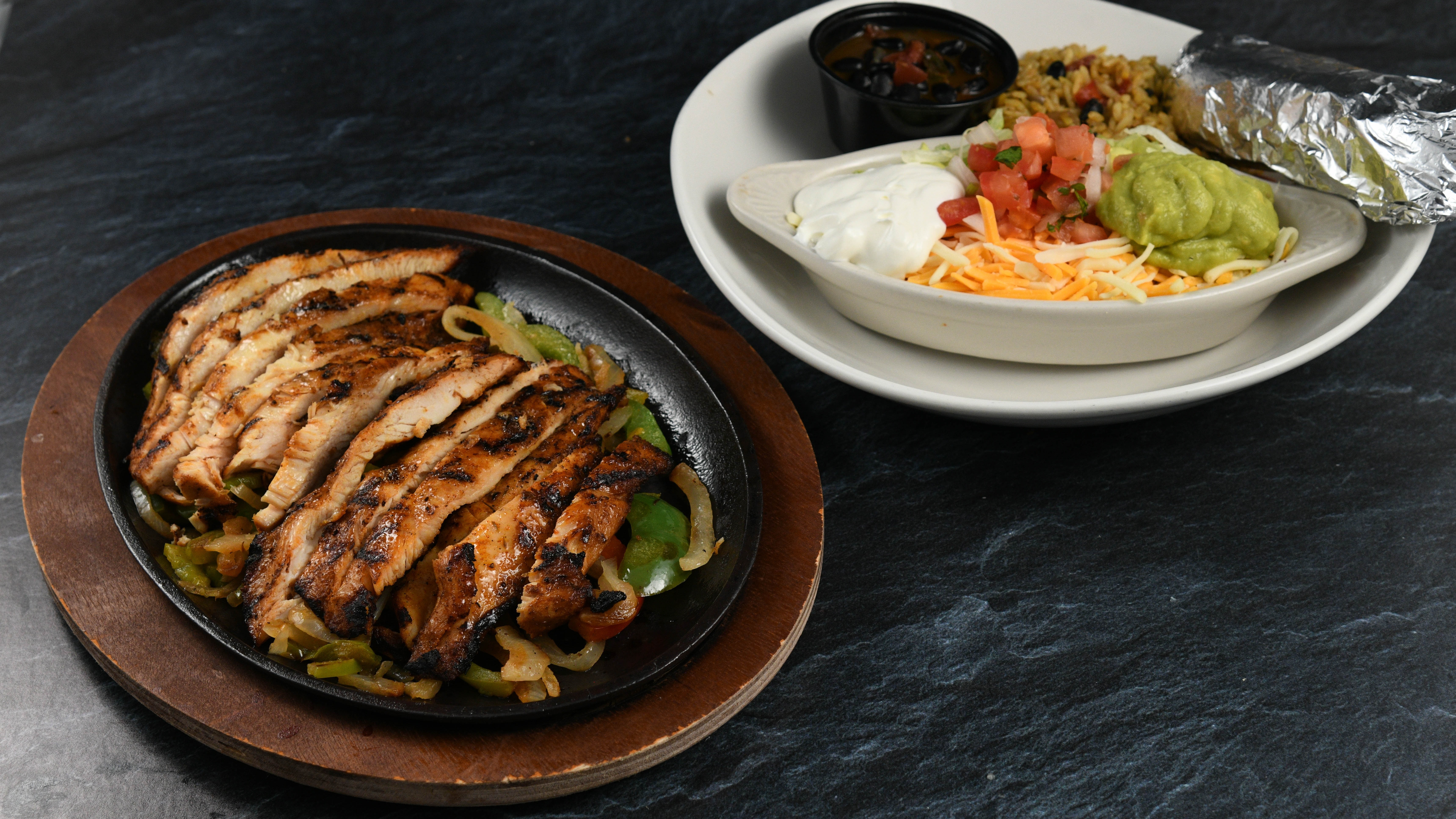 Order Amazon Fajitas - Chicken food online from Rainforest Cafe store, Tempe on bringmethat.com
