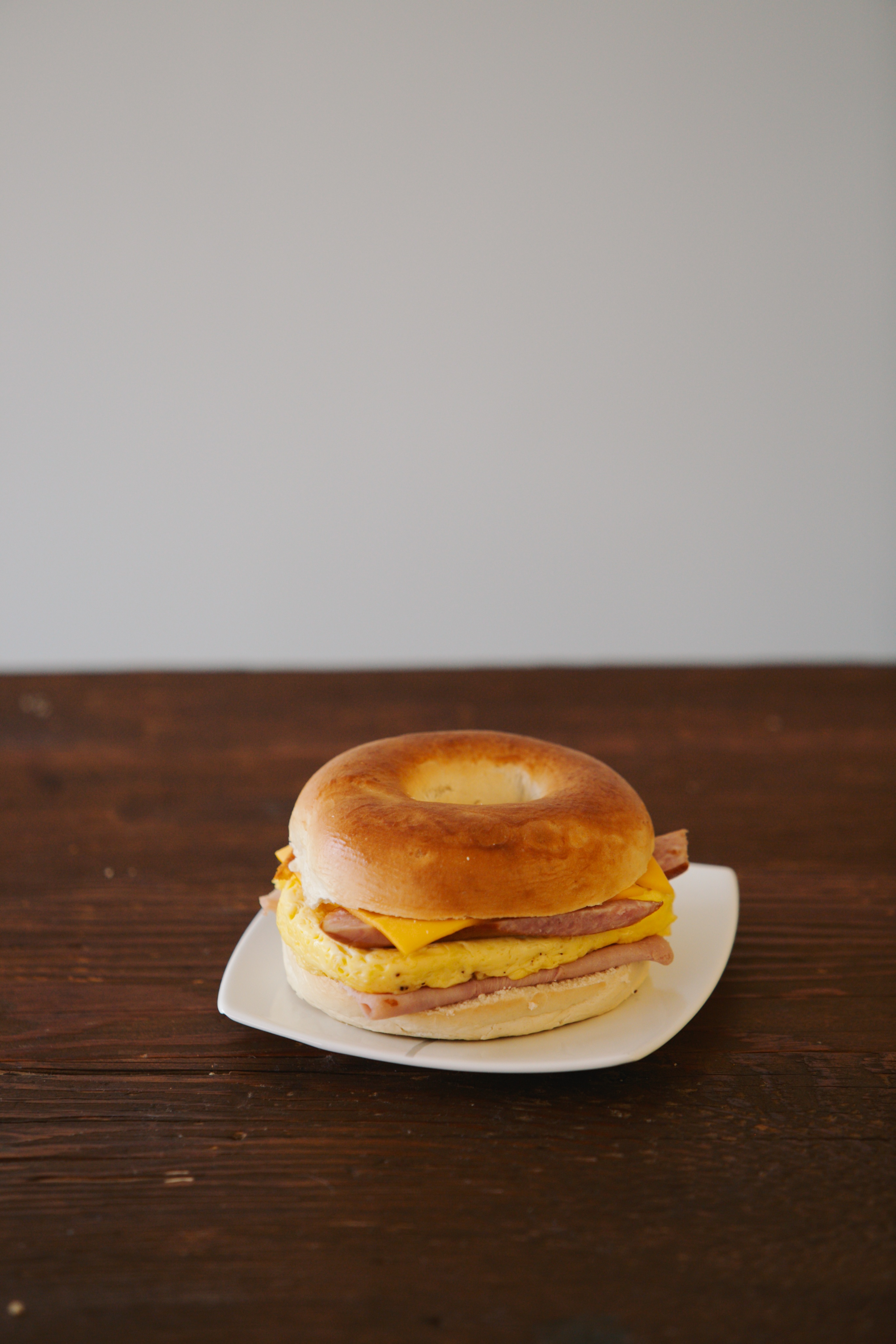 Order Egg Ham Sausage Cheese Bagel Sandwich food online from Smile Donuts store, Hurst on bringmethat.com