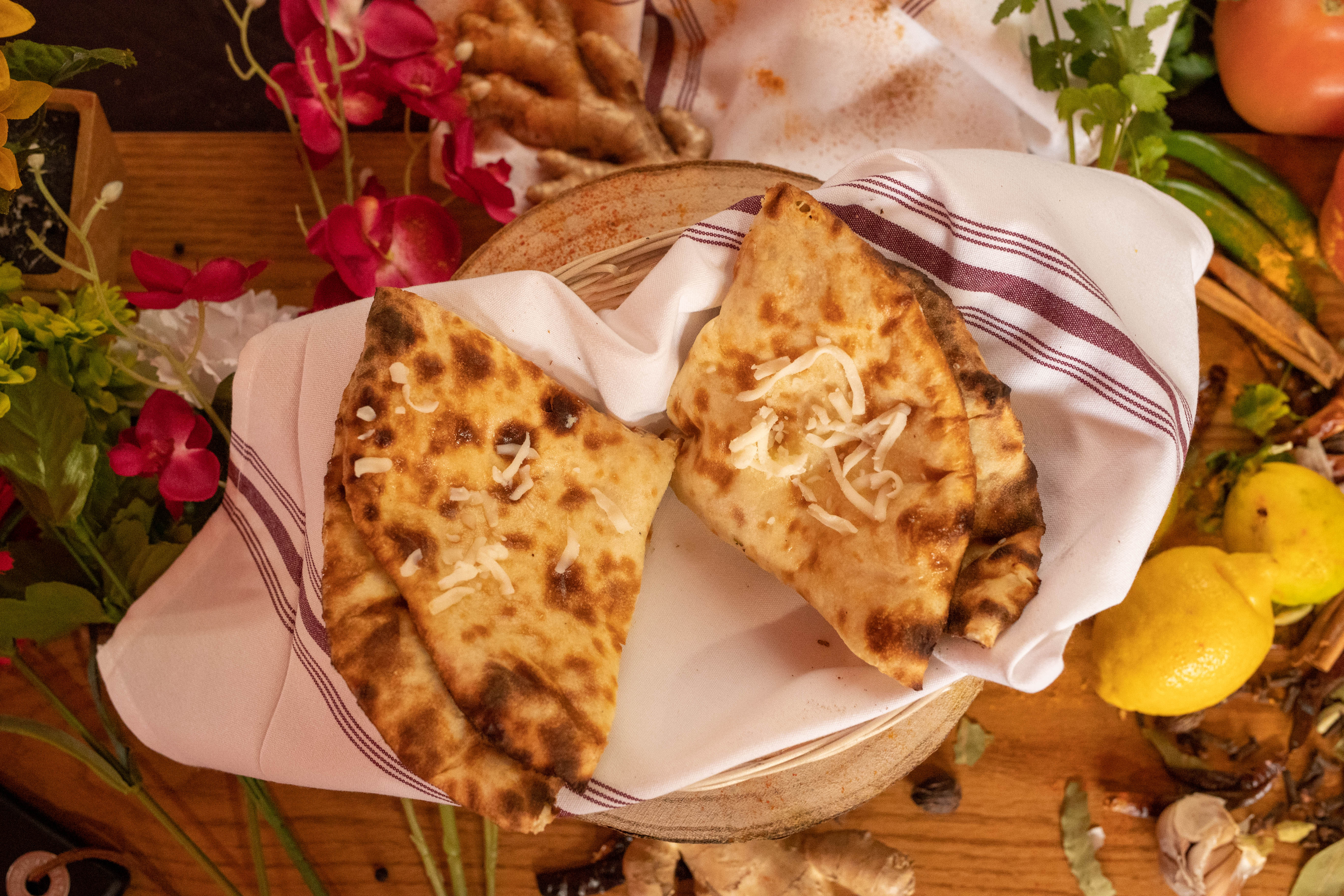 Order Cheese Naan food online from Urban curry store, San Francisco on bringmethat.com