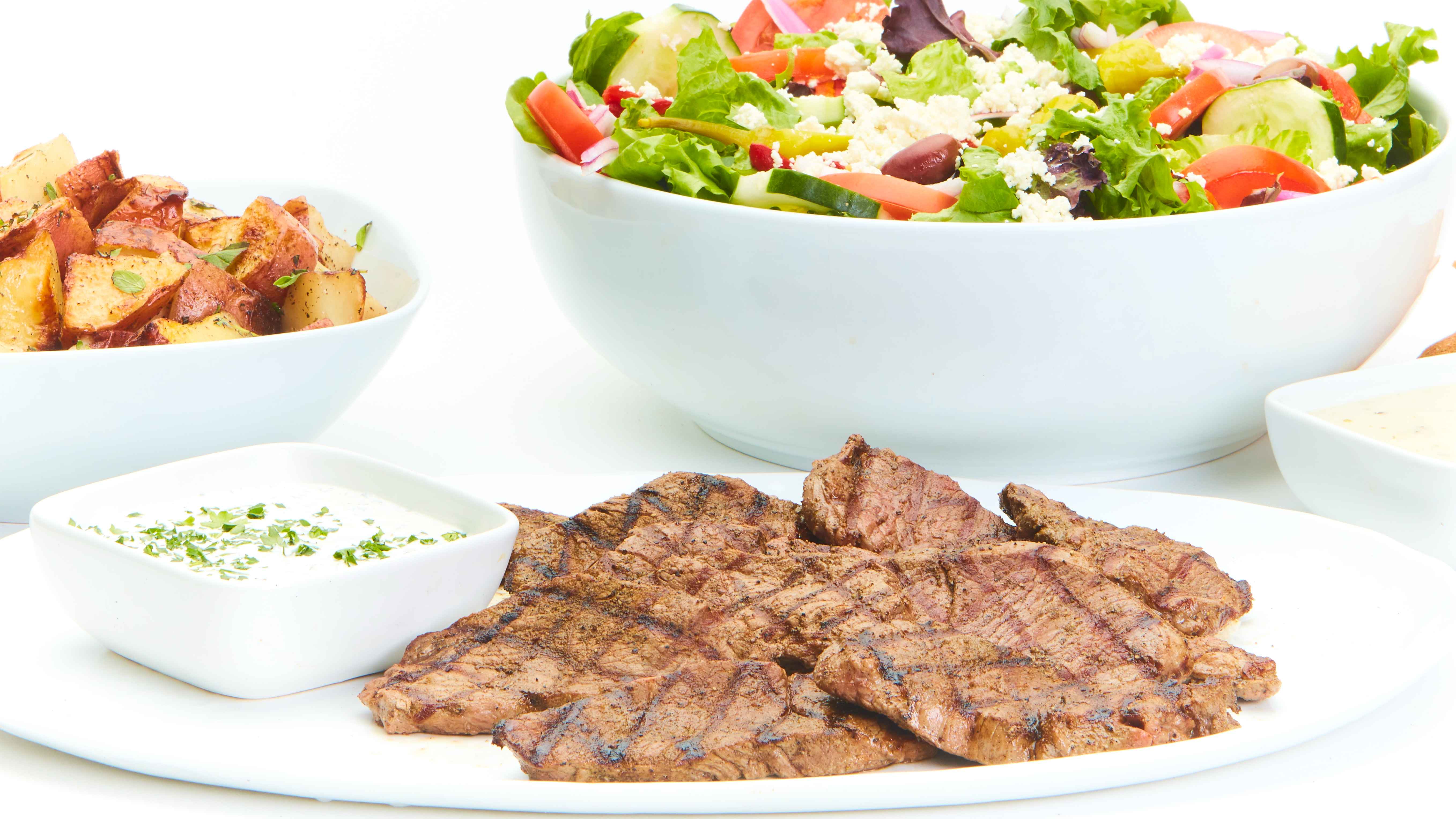 Order Grilled Lamb Feast for 6 food online from Taziki's Mediterranean Cafe store, Charlotte on bringmethat.com