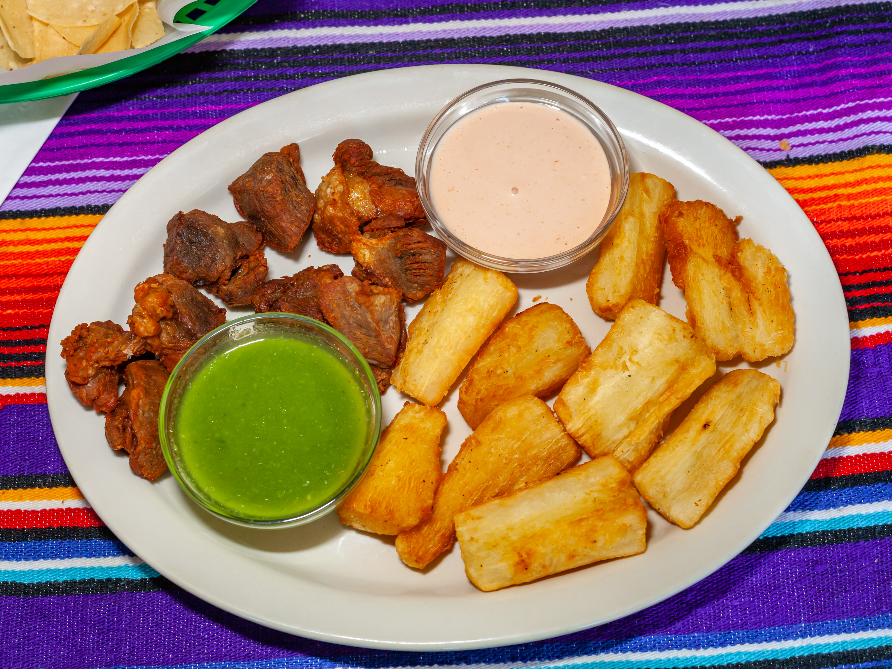 Order Yuca con Chicharron food online from El Rincon Del Sabor Bar & Grill store, Fredericksburg on bringmethat.com