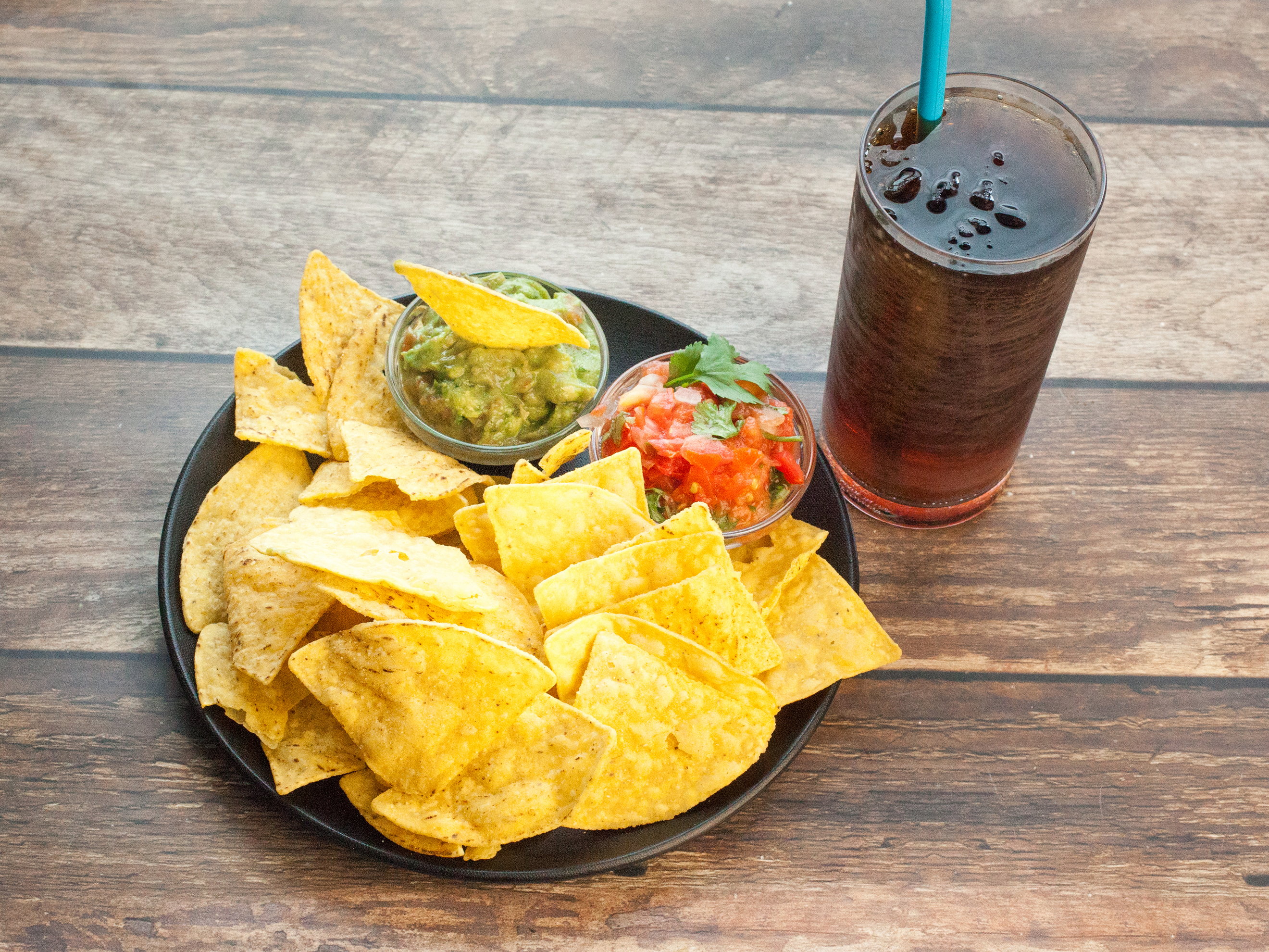 Order Chips, Guacamole, and Drink Combo food online from Taco Del Mar store, Seattle on bringmethat.com