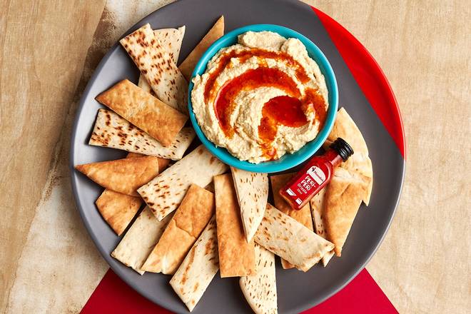 Order Hummus with PERi-PERi Drizzle food online from Nan's store, Chicago on bringmethat.com