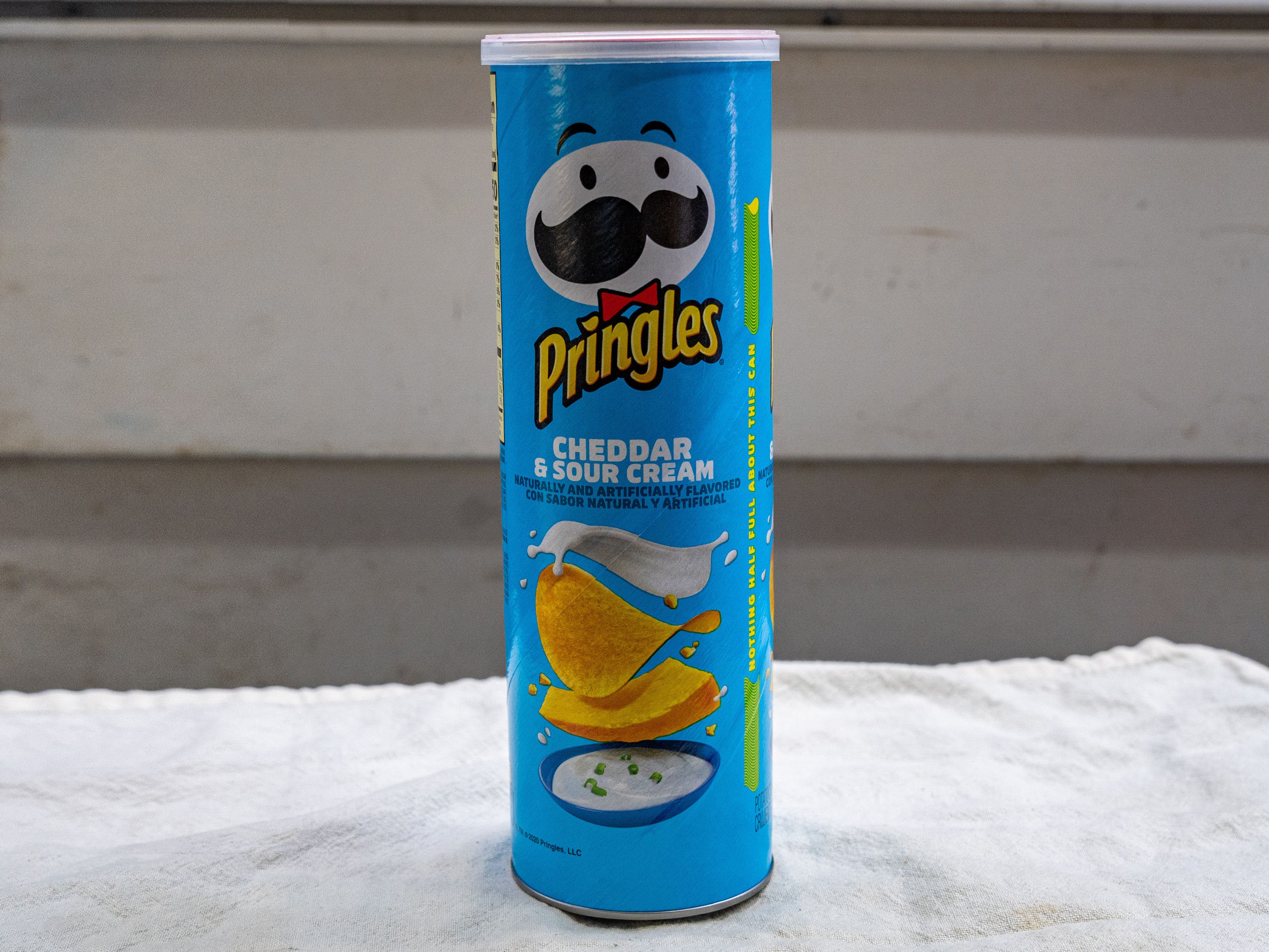Order Pringles Cheddar & sour cream -5.2oz food online from Quentin Deli and Grocery store, Brooklyn on bringmethat.com