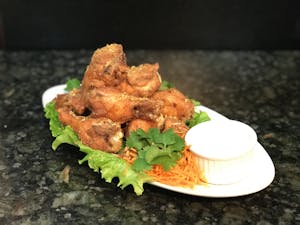 Order 14. Garlic Wings (Not Spicy) food online from Thai Time Bistro store, San Diego on bringmethat.com