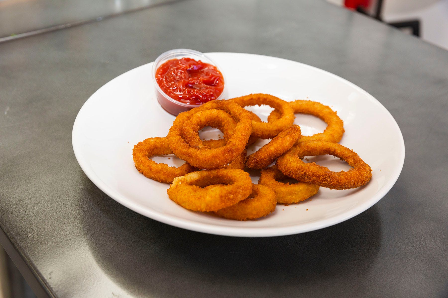 Order Onion Rings - Appetizers food online from College Pizza store, Boston on bringmethat.com