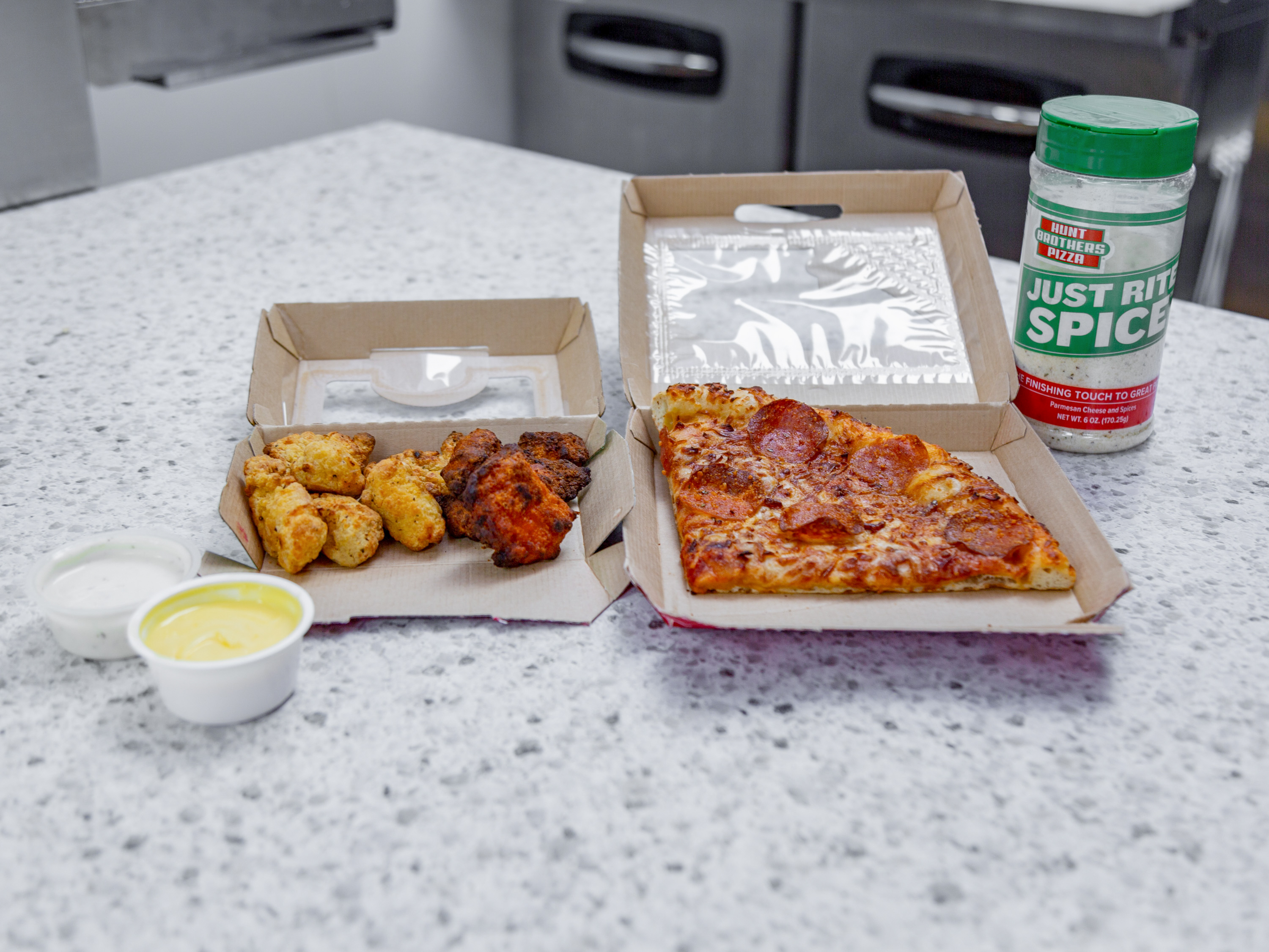 Order Hunk a Pizza and Single Order of Wing Bites food online from Hunt Brothers Pizza store, Stockbridge on bringmethat.com