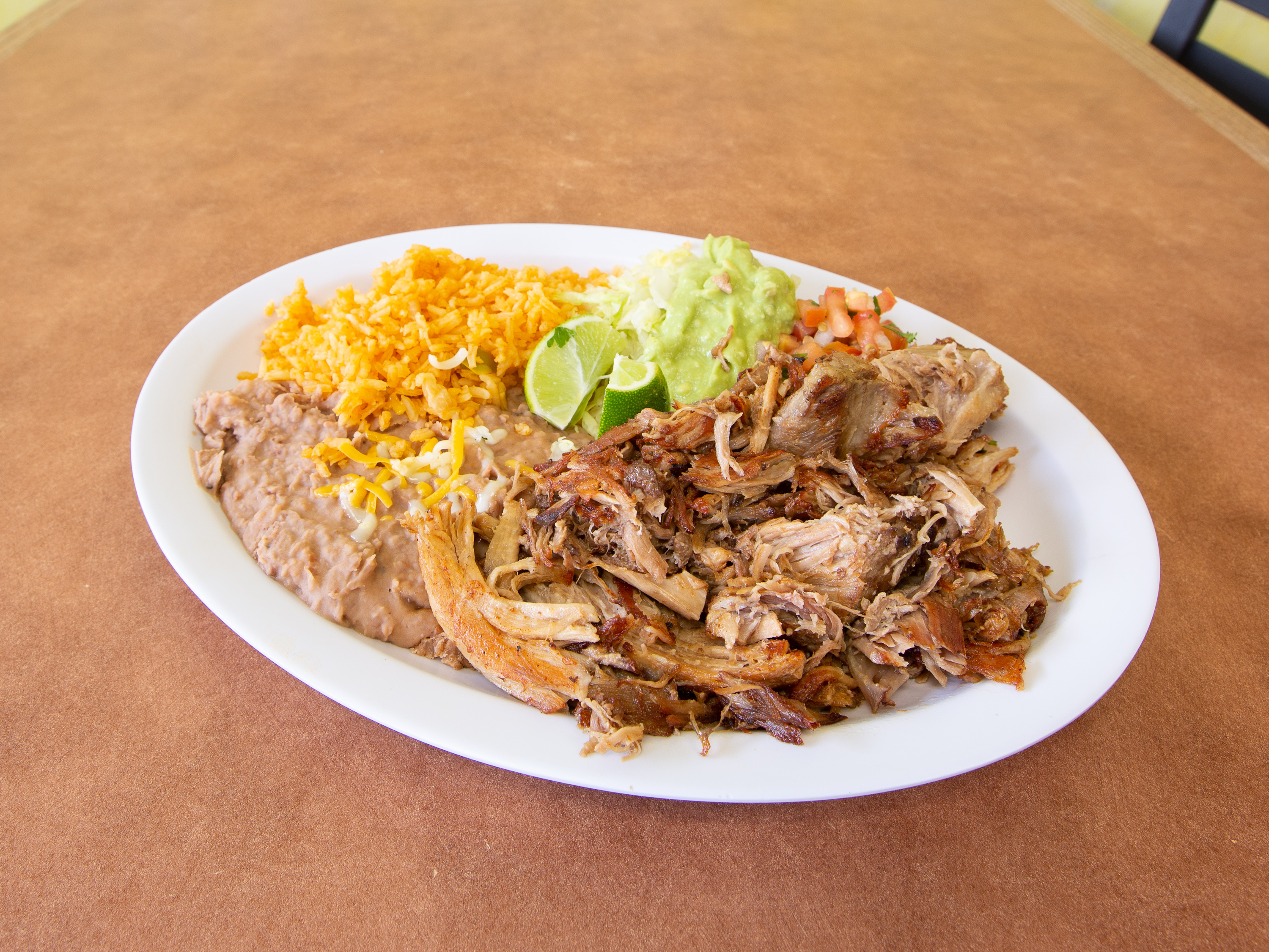 Order 11. Carnitas Combo Plate food online from Mauricio Mexican & Seafood store, San Diego on bringmethat.com