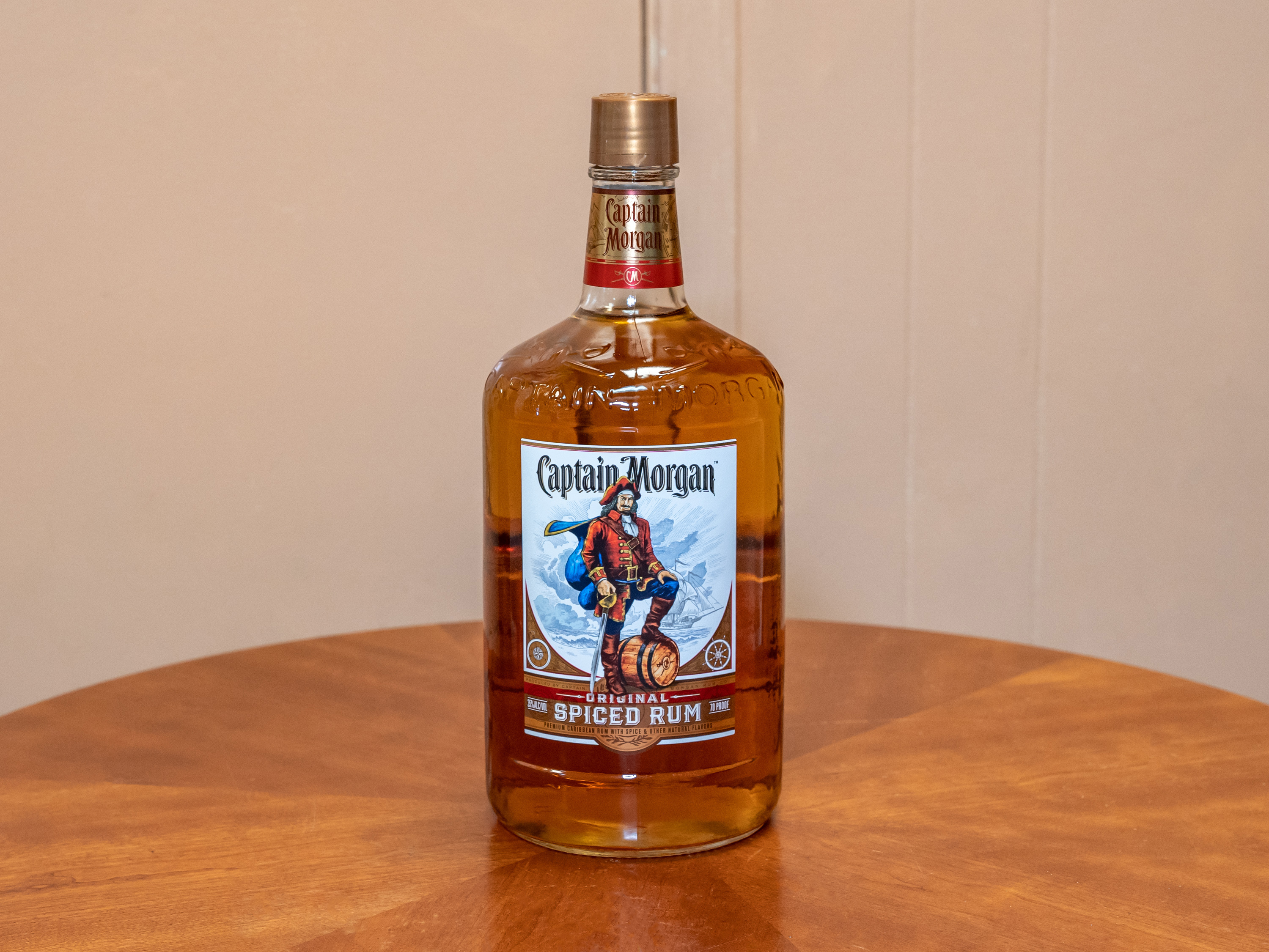 Order Captain Morgan Spiced, 1.75 Liter Rum food online from Jose's Wines & Liquors store, Valley Cottage on bringmethat.com