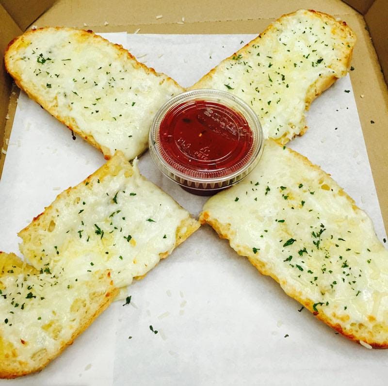 Order Garlic Cheese Bread - Appetizer food online from Rudino's Pizza & Grinders store, Knightdale on bringmethat.com