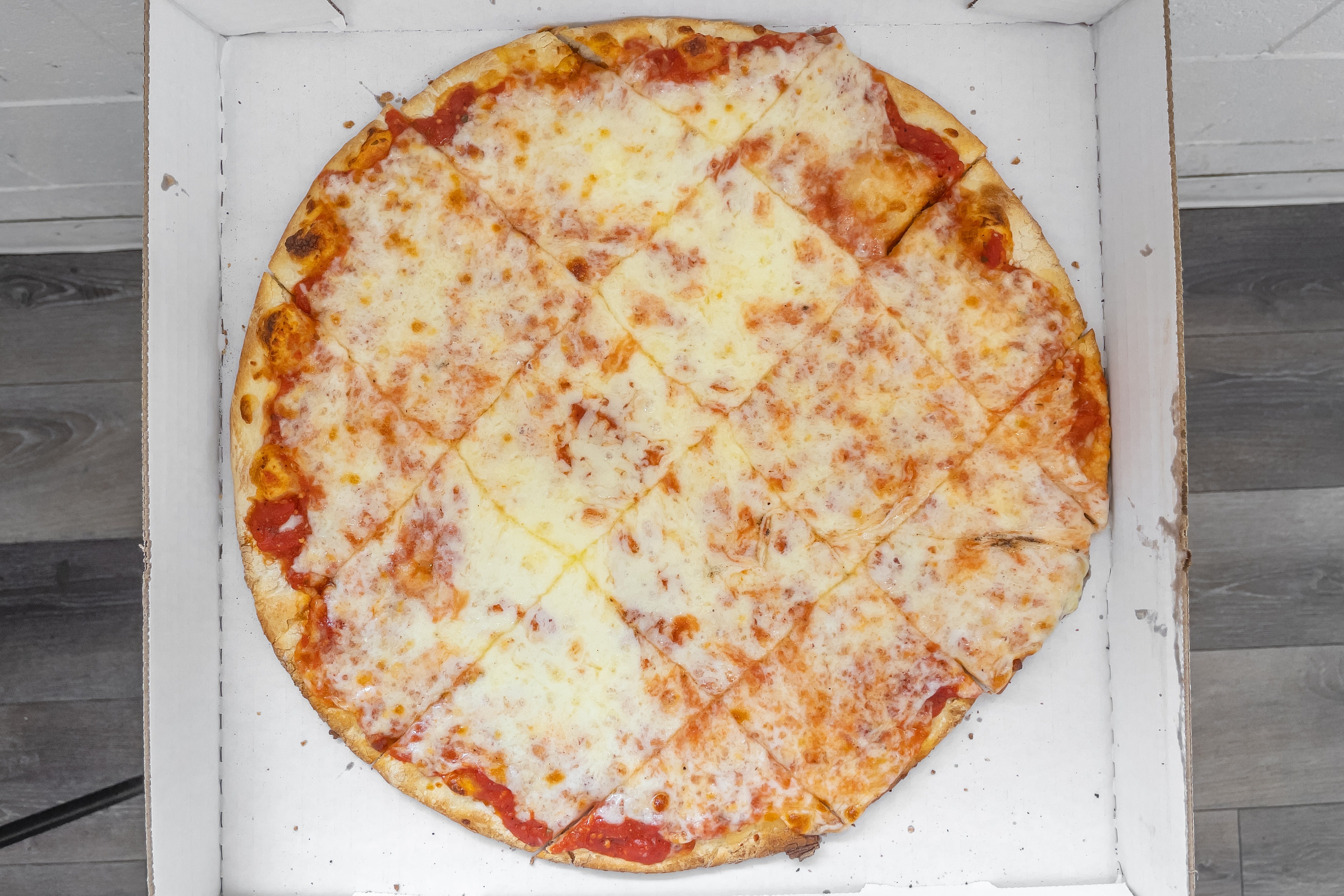 Order Thin Crust Cheese Pizza - Small 10'' food online from Gianni Pizza & Italian Ristorante store, Hillsboro on bringmethat.com