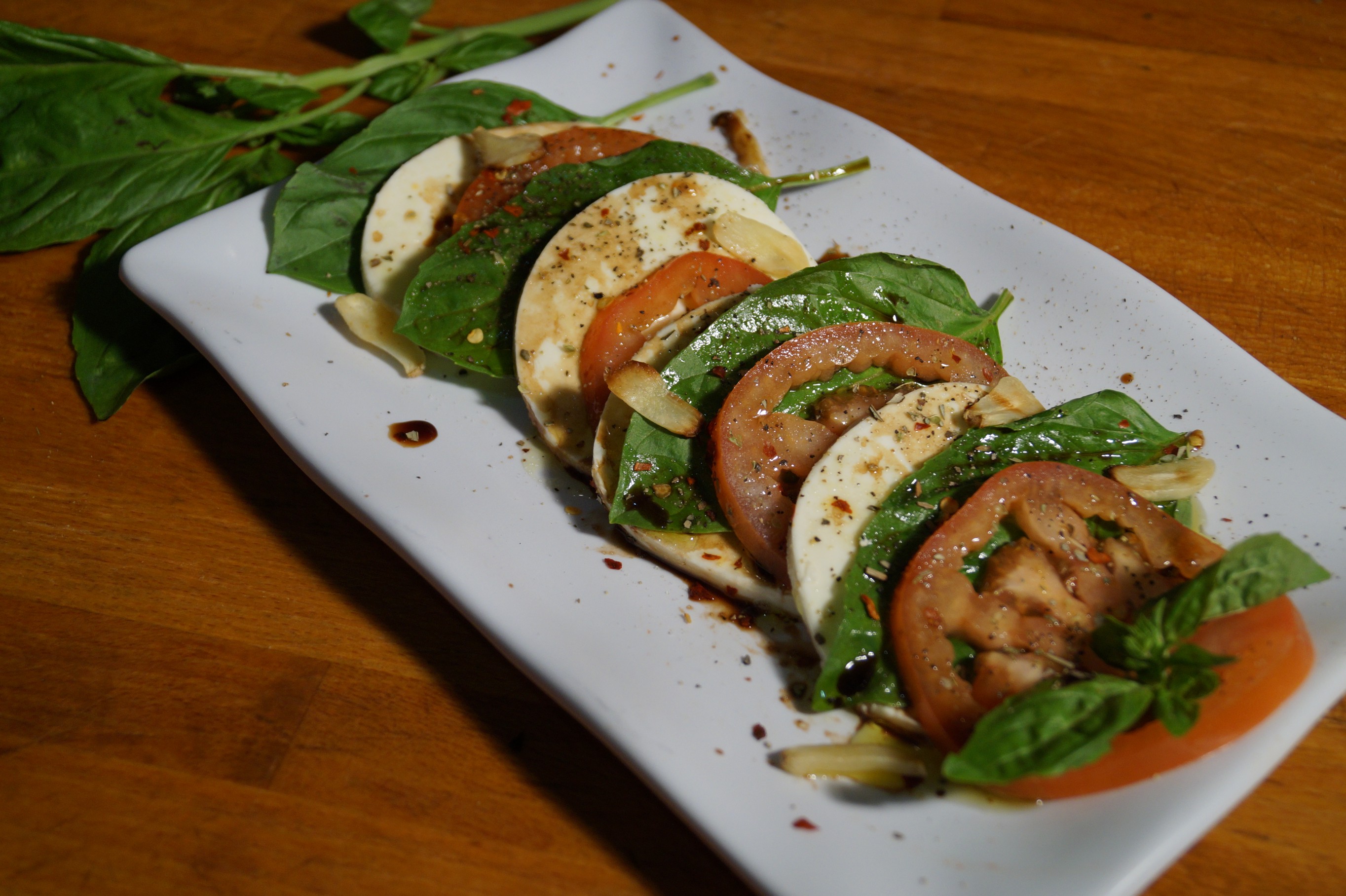 Order Caprese Salad food online from Pizza Lounge store, Houston on bringmethat.com