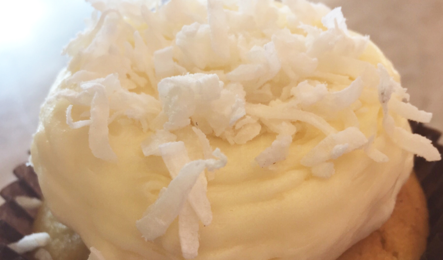 Order Coconut Cupcake food online from Smallcakes Cupcakery And Creamery store, Naperville on bringmethat.com