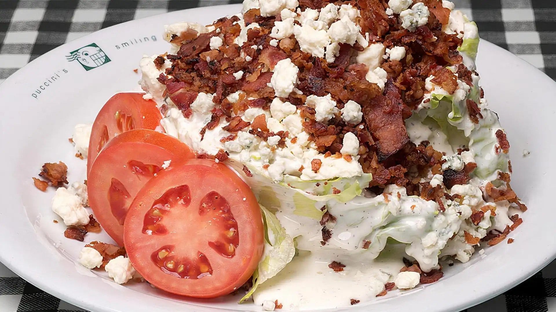 Order Gluten Free Bucceto’s Blue Cheese Wedge Salad - Salad food online from Bucceto's store, Bloomington on bringmethat.com