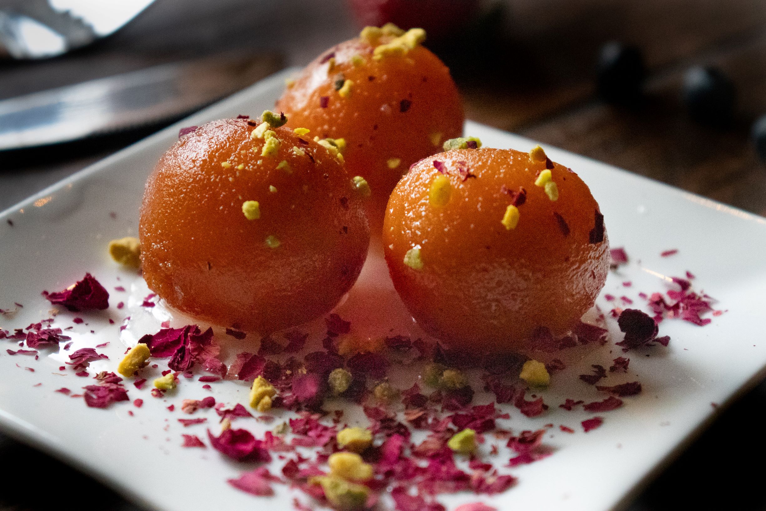 Order Gulab jamun w / Roasted nuts food online from Spice Kraft Indian Bistro store, Arlington on bringmethat.com