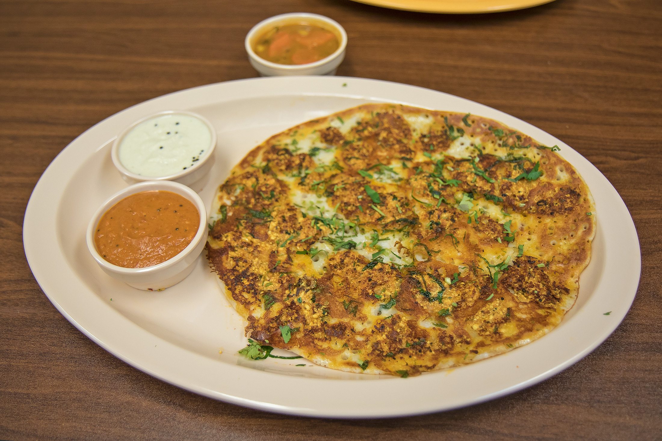 Order Paneer Utappam food online from Abhiruchi store, Sunnyvale on bringmethat.com
