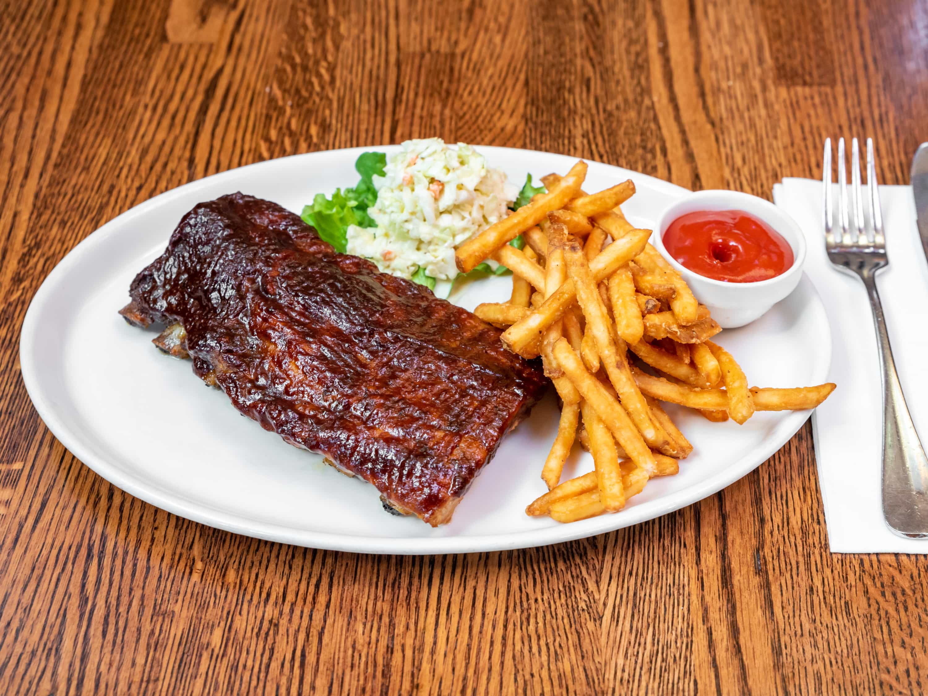 Order BBQ Baby Back Ribs food online from P.J. Skidoos store, Fairfax on bringmethat.com
