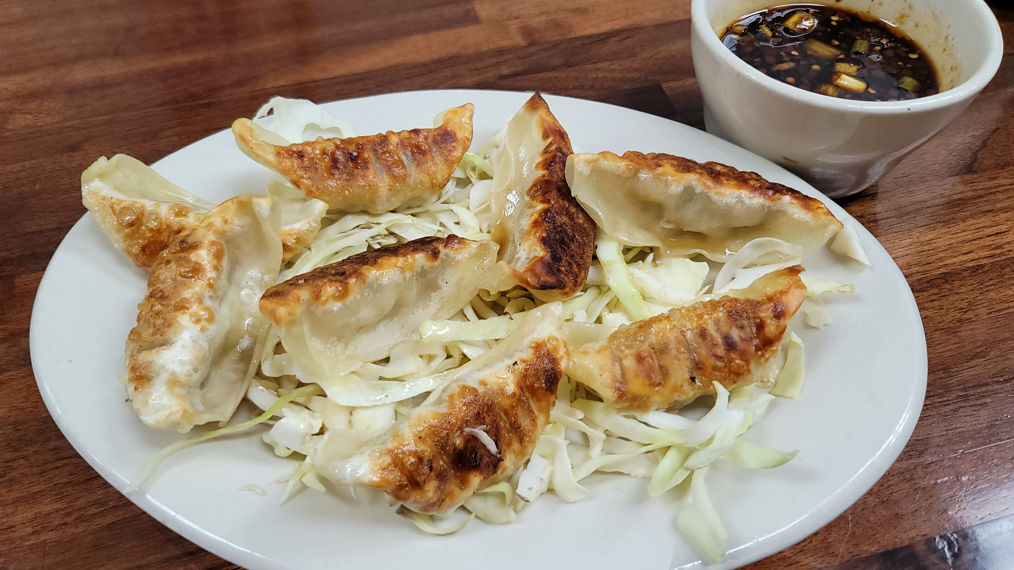 Order 8 Pot Stickers food online from China Cafe store, Austin on bringmethat.com